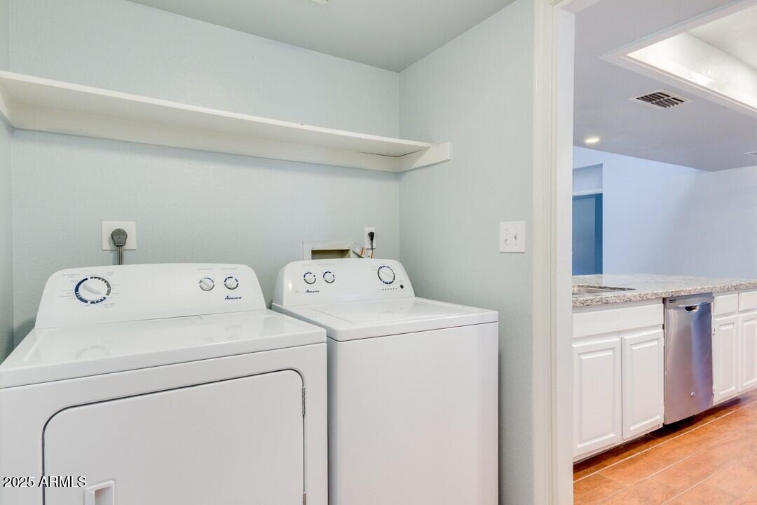 6900 East Gold Dust Avenue, Unit 149 Paradise Valley, AZ 85253 - Photo 33 of 34 a utility room with dryer and washer