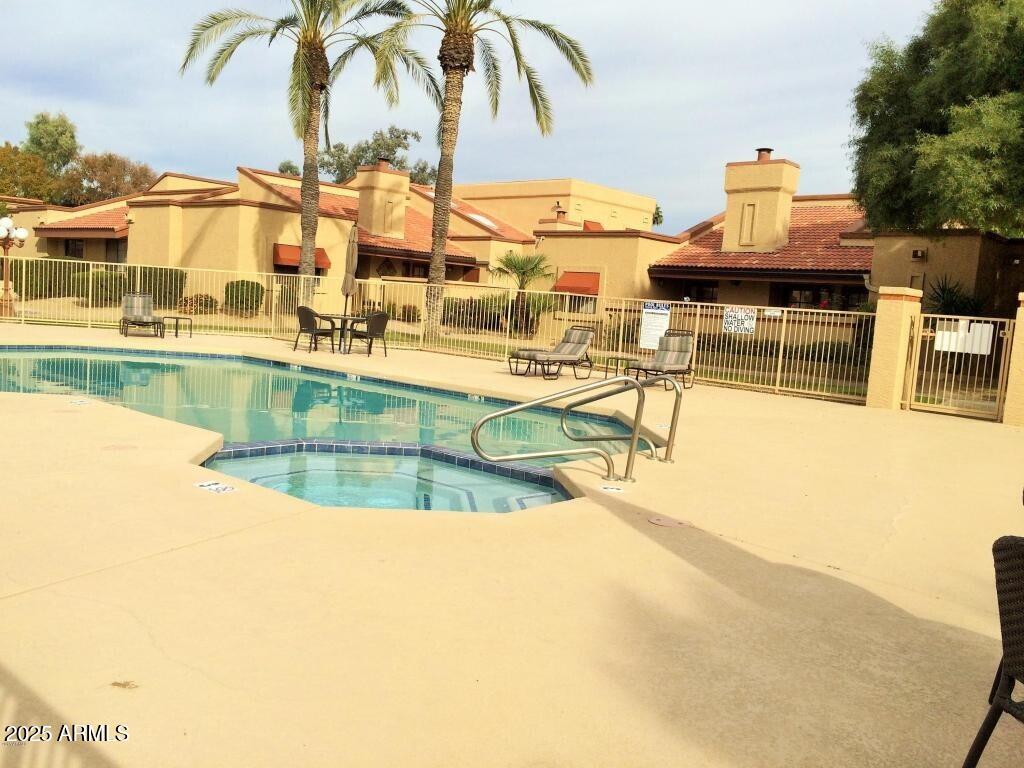 6900 East Gold Dust Avenue, Unit 149 Paradise Valley, AZ 85253 - Photo 34 of 34 a view of a swimming pool with outdoor seating