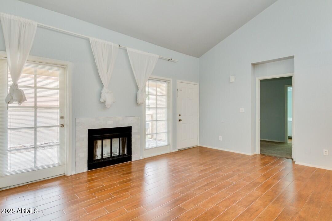 6900 East Gold Dust Avenue, Unit 149 Paradise Valley, AZ 85253 - Photo 9 of 34 a view of an empty room with window and fire place