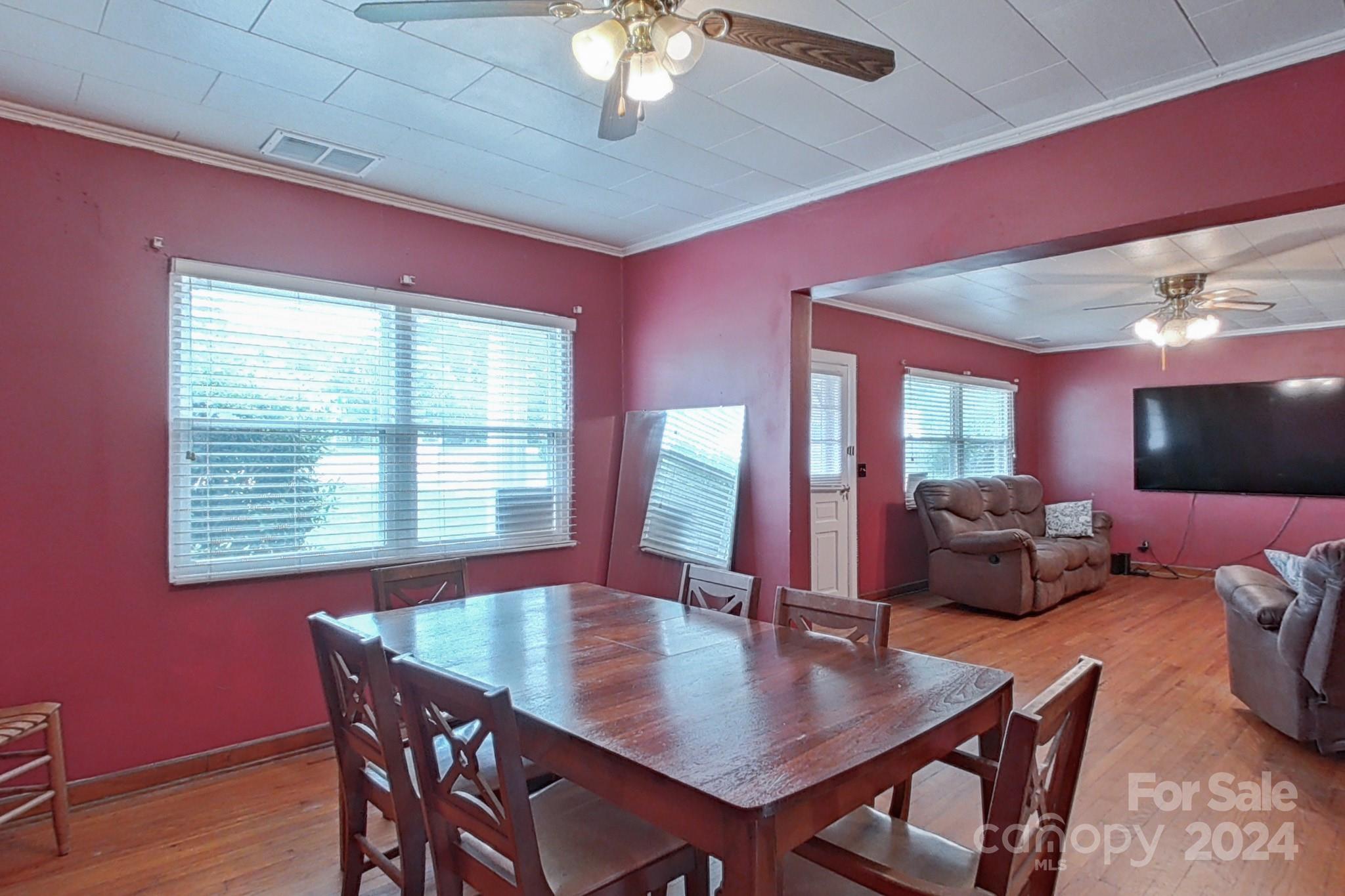 700 South Myrtle School Road Gastonia, NC 28052 - Photo 12 of 40 a view of a dining room with furniture and chandelier
