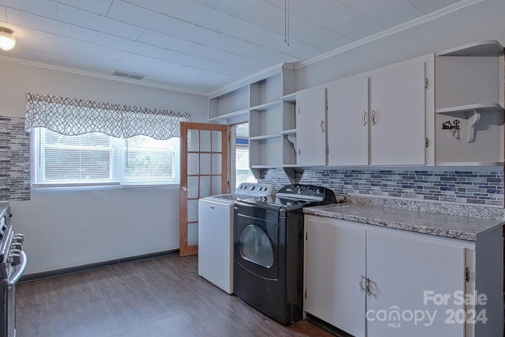 700 South Myrtle School Road Gastonia, NC 28052 - Photo 14 of 40 a kitchen with stainless steel appliances granite countertop a stove and a refrigerator