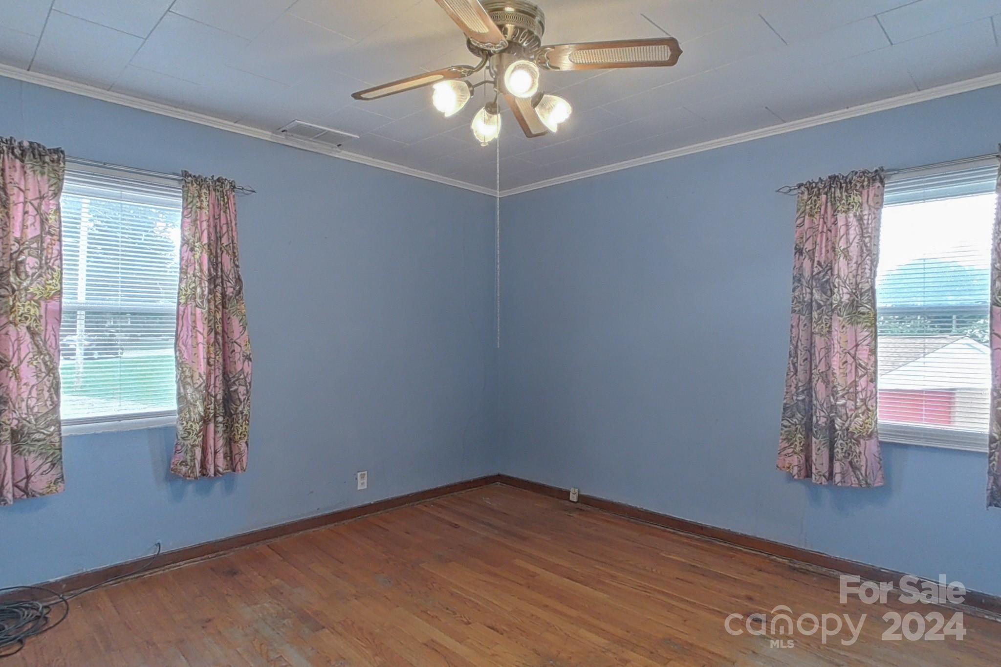 700 South Myrtle School Road Gastonia, NC 28052 - Photo 18 of 40 a view of empty room with window and chandelier fan