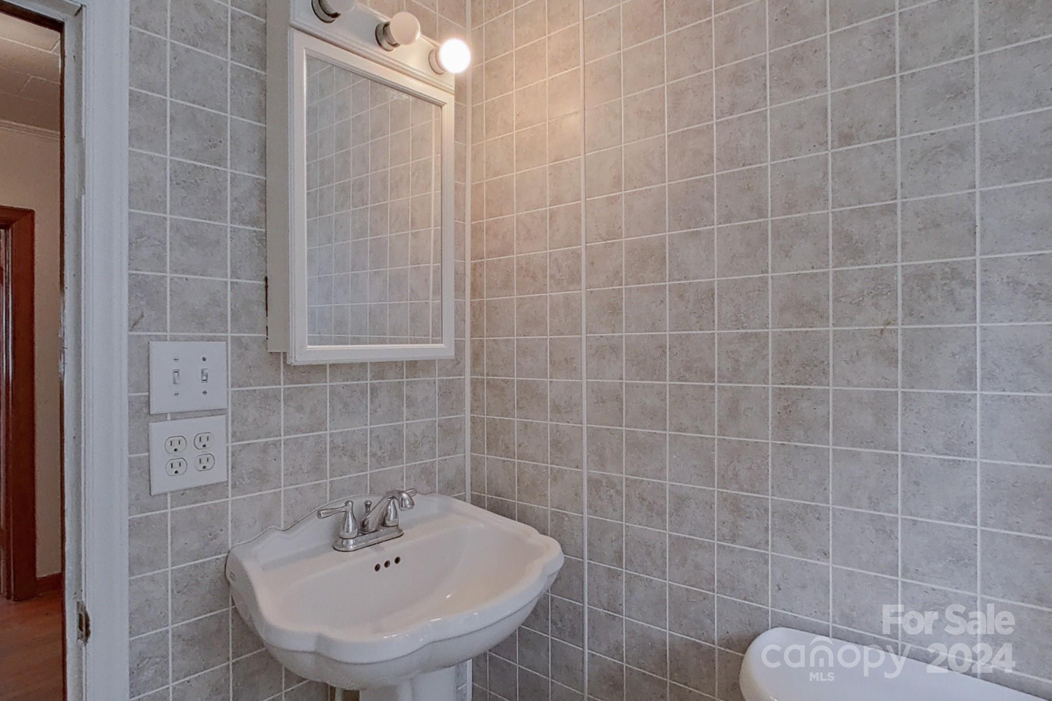 700 South Myrtle School Road Gastonia, NC 28052 - Photo 20 of 40 a bathroom with a sink shower