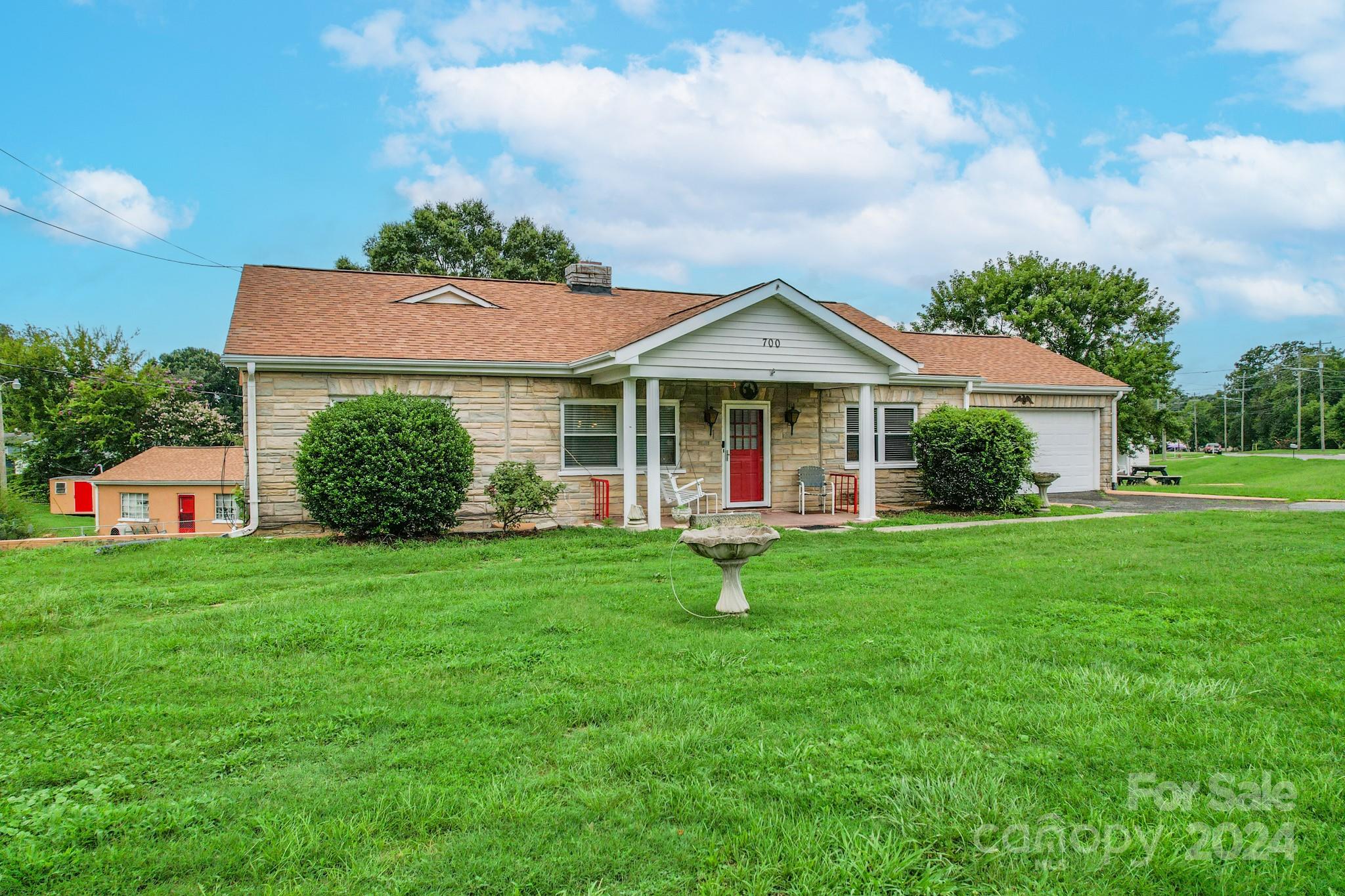 700 South Myrtle School Road Gastonia, NC 28052 - Photo 2 of 40 a front view of a house with garden