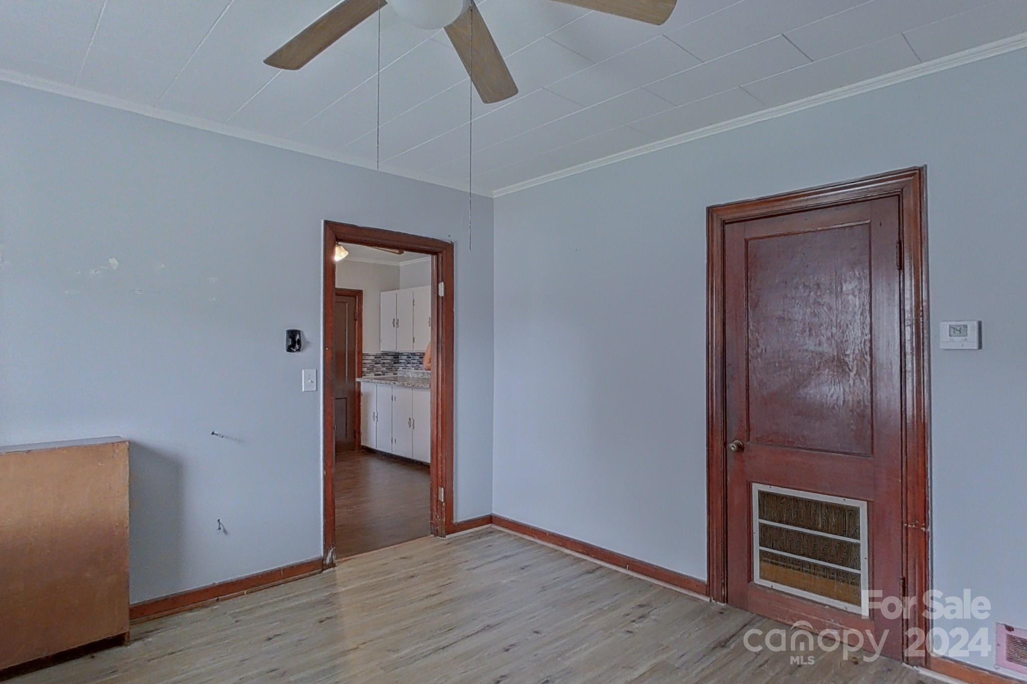 700 South Myrtle School Road Gastonia, NC 28052 - Photo 23 of 40 an empty room with wooden floor cabinet and windows
