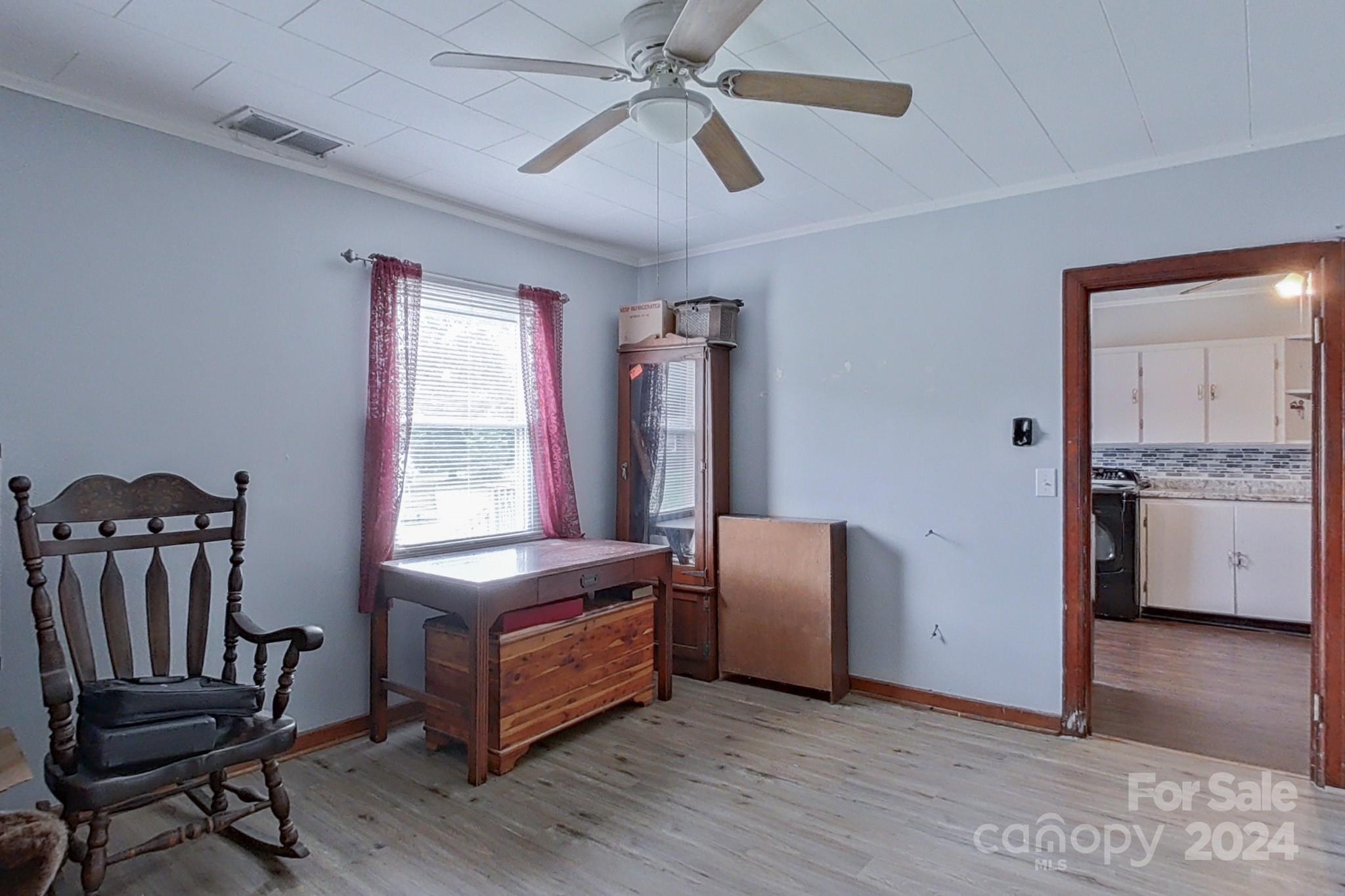 700 South Myrtle School Road Gastonia, NC 28052 - Photo 24 of 40 a living room with furniture and a chandelier