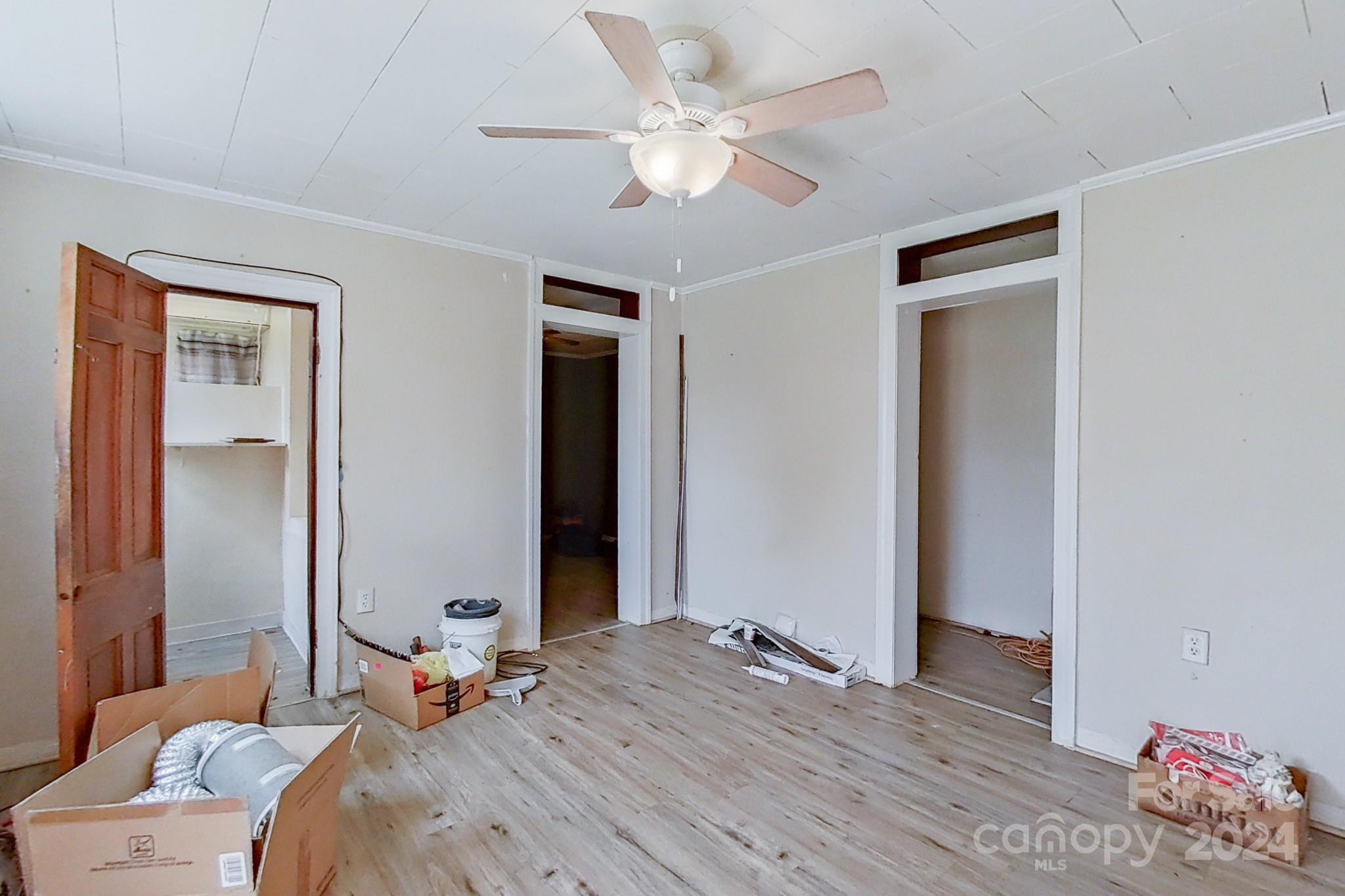 700 South Myrtle School Road Gastonia, NC 28052 - Photo 28 of 40 a bedroom with a bed and a chandelier