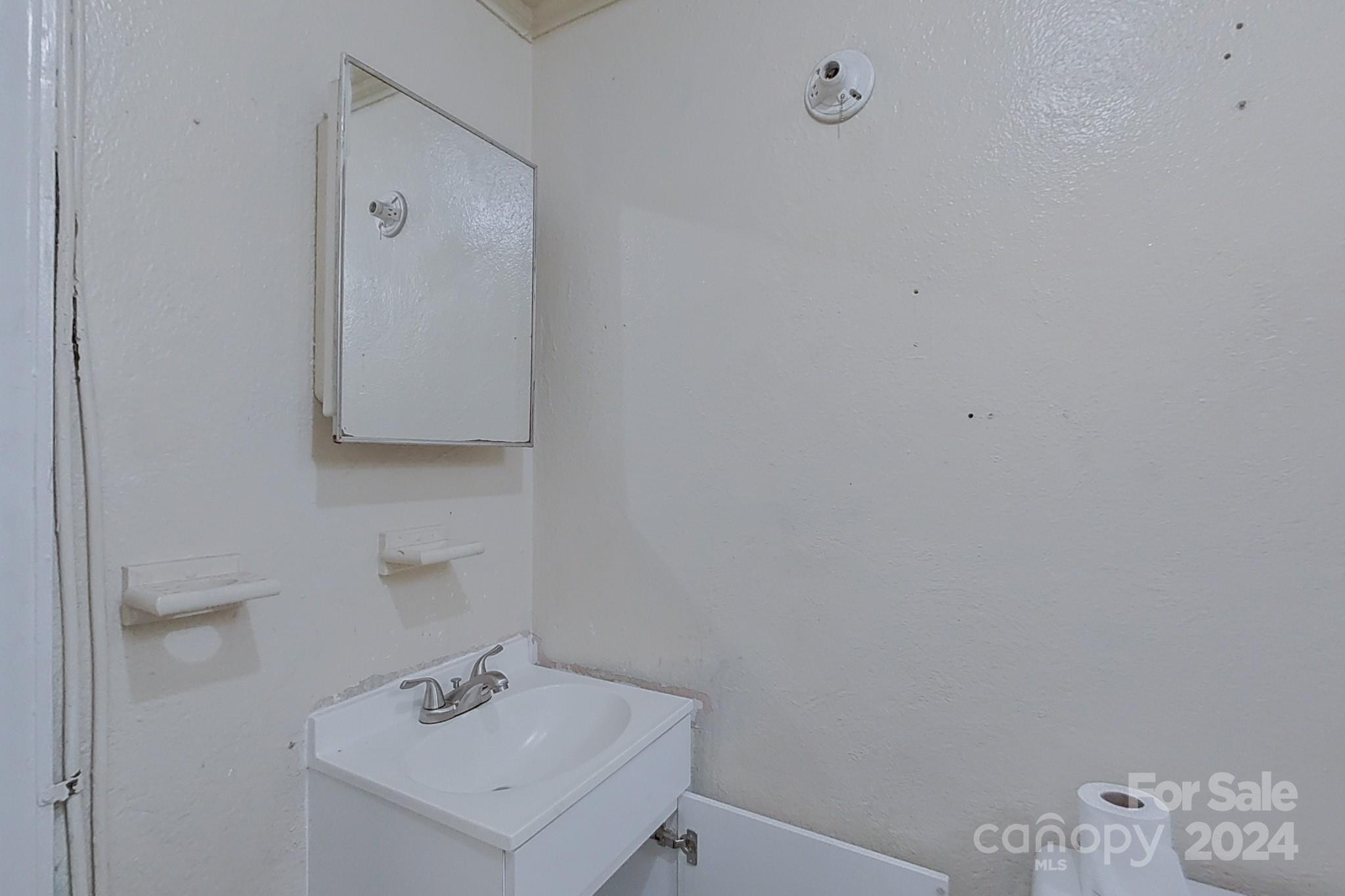 700 South Myrtle School Road Gastonia, NC 28052 - Photo 29 of 40 a white bathroom with a sink and vanity