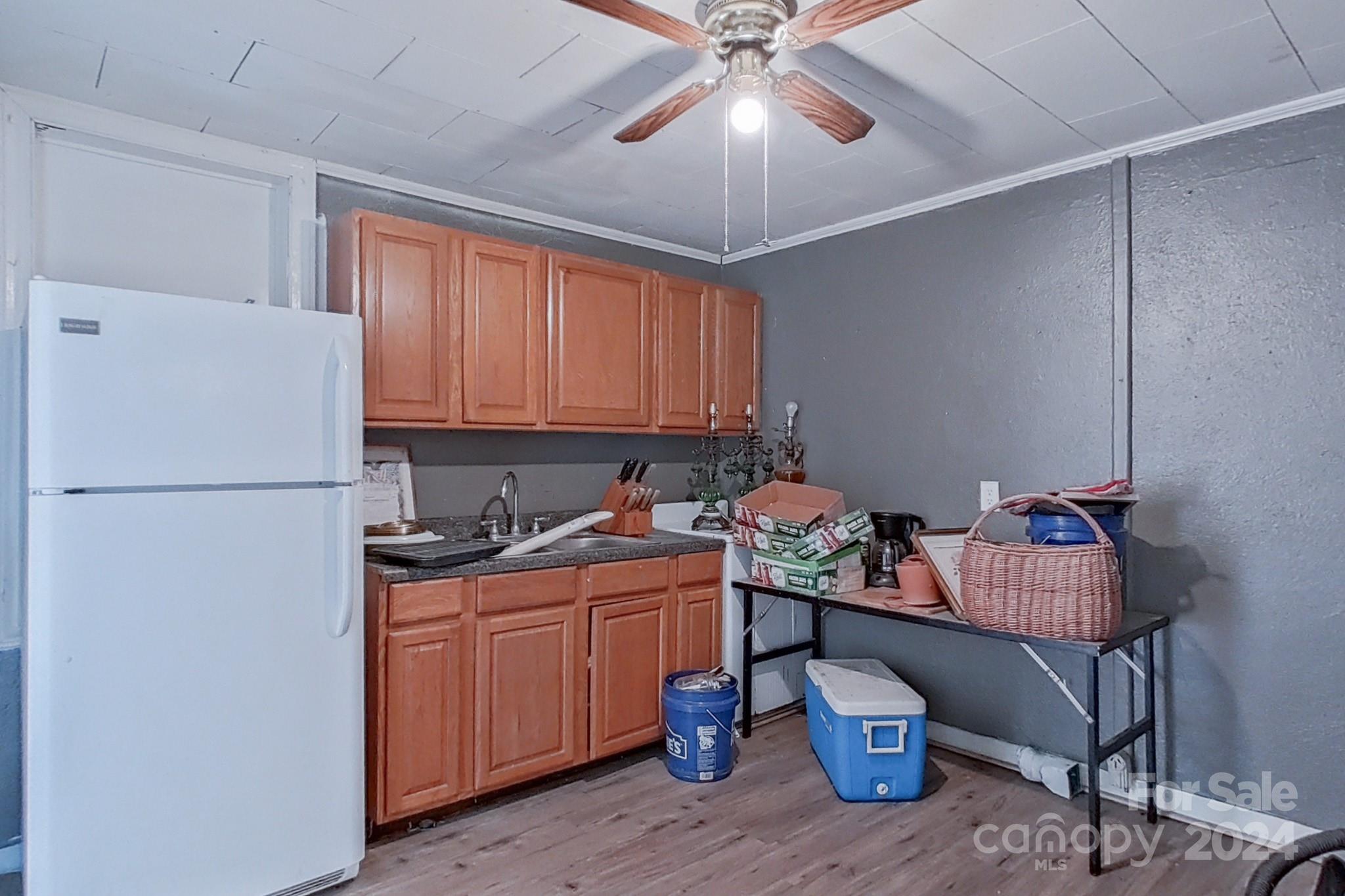 700 South Myrtle School Road Gastonia, NC 28052 - Photo 31 of 40 a kitchen with a refrigerator a sink and cabinets