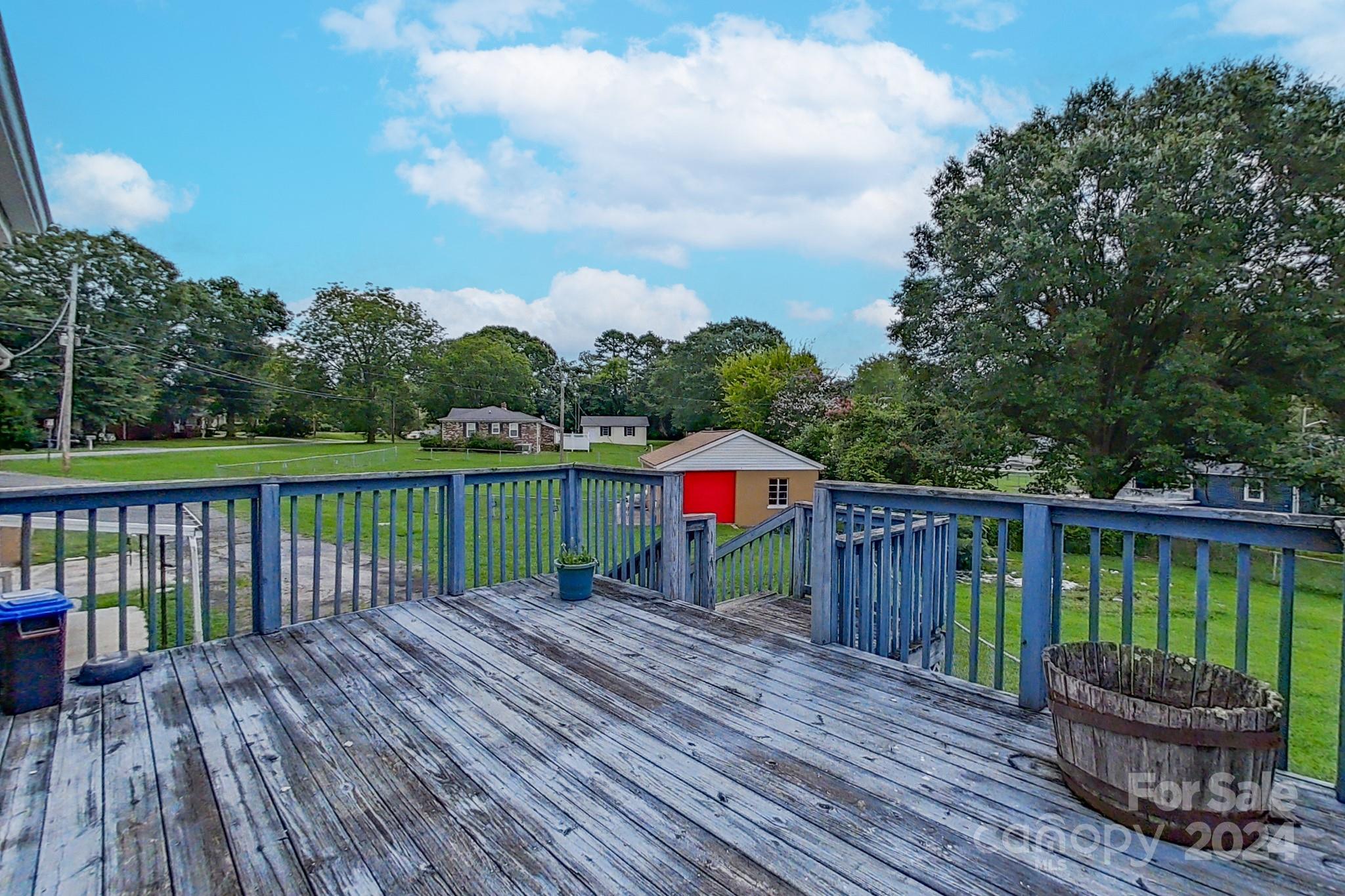 700 South Myrtle School Road Gastonia, NC 28052 - Photo 37 of 40 a view of a wooden deck with a yard