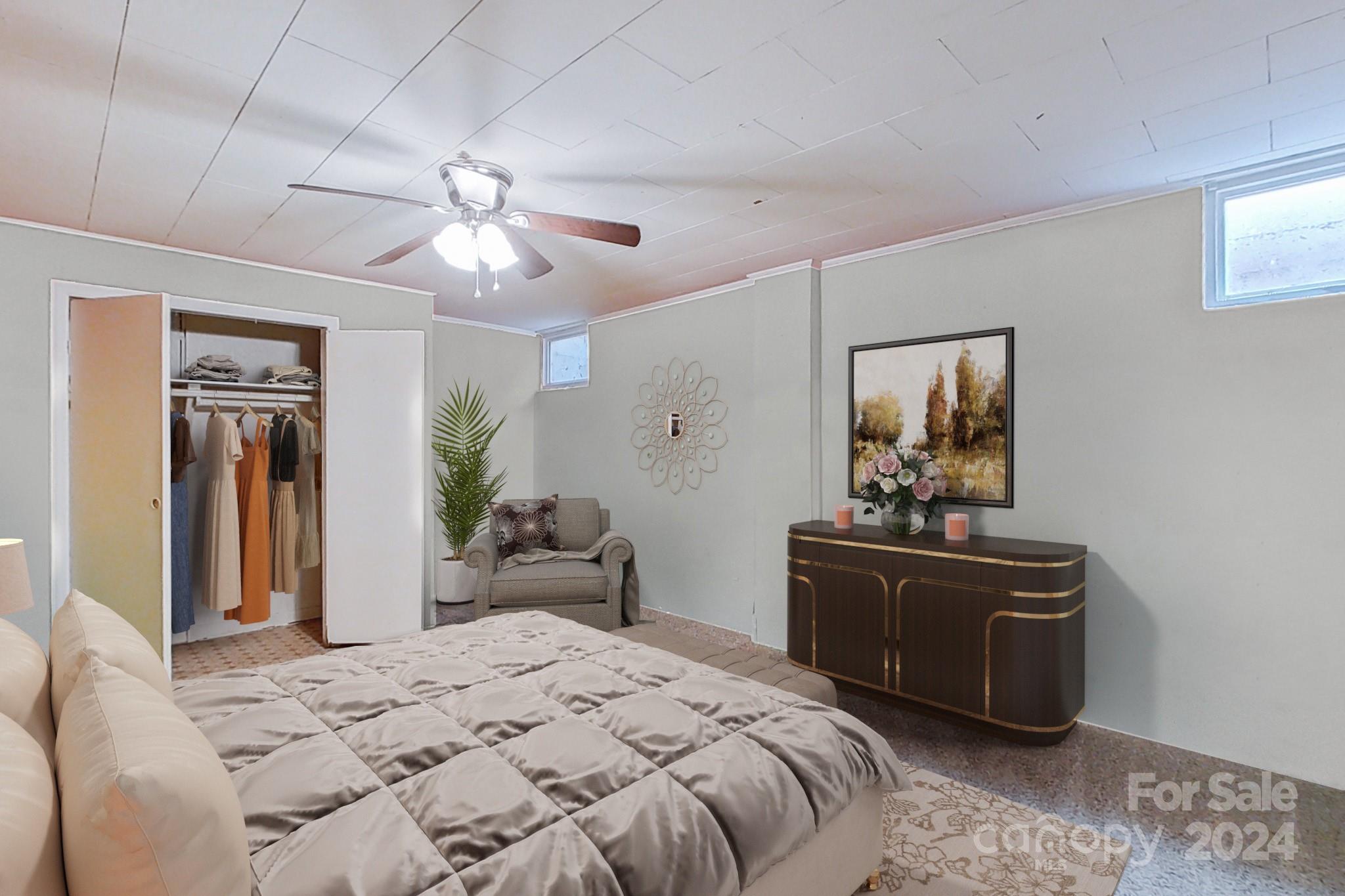 700 South Myrtle School Road Gastonia, NC 28052 - Photo 4 of 40 a bedroom with a bed and a chandelier