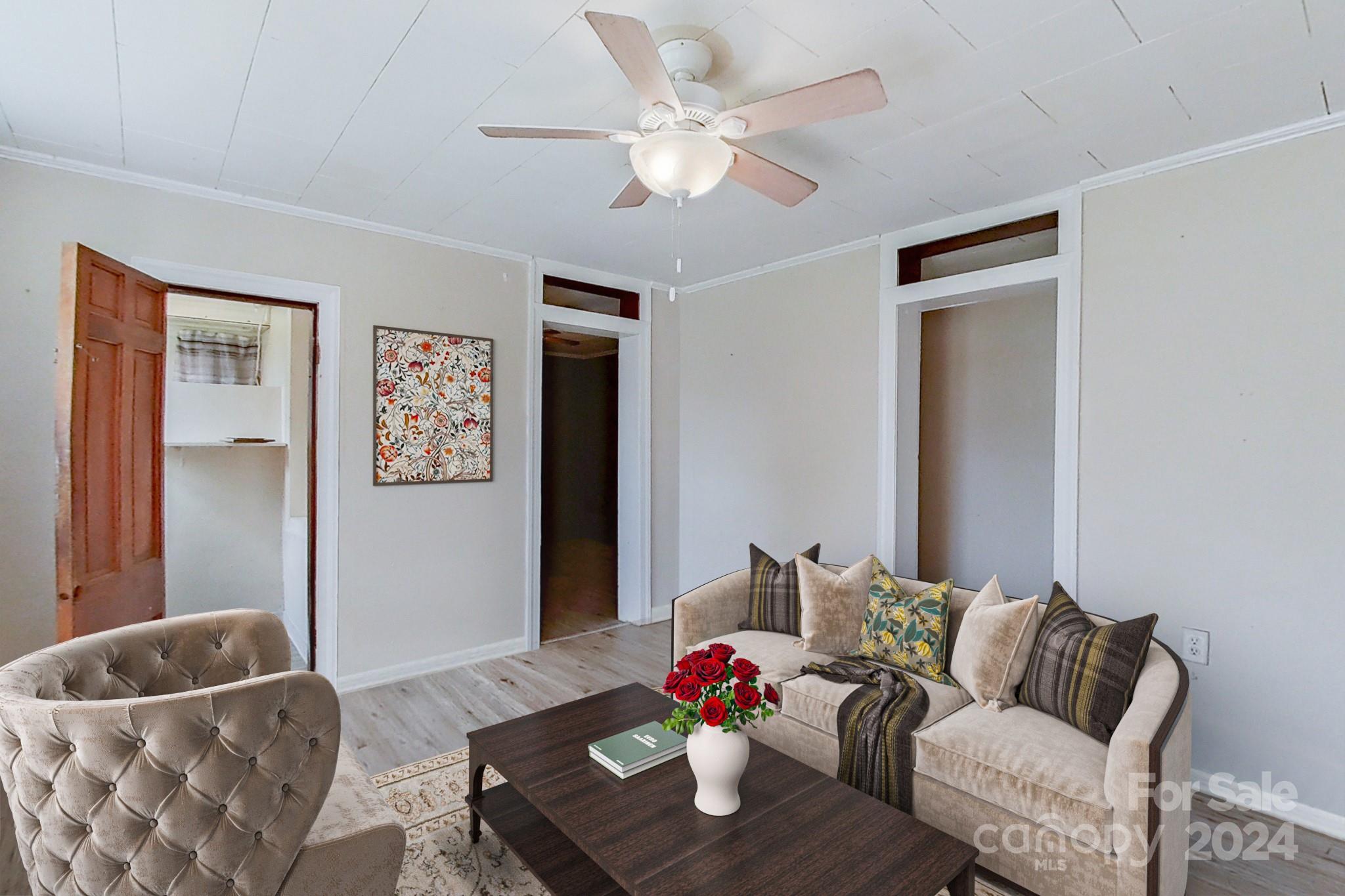 700 South Myrtle School Road Gastonia, NC 28052 - Photo 6 of 40 a living room with furniture and a potted plant
