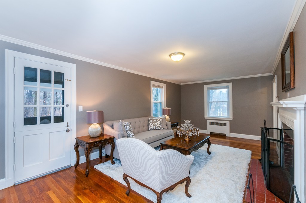 327 Edgell Road Framingham, MA 01701 - Photo 3 of 13 a living room with furniture a window and a table