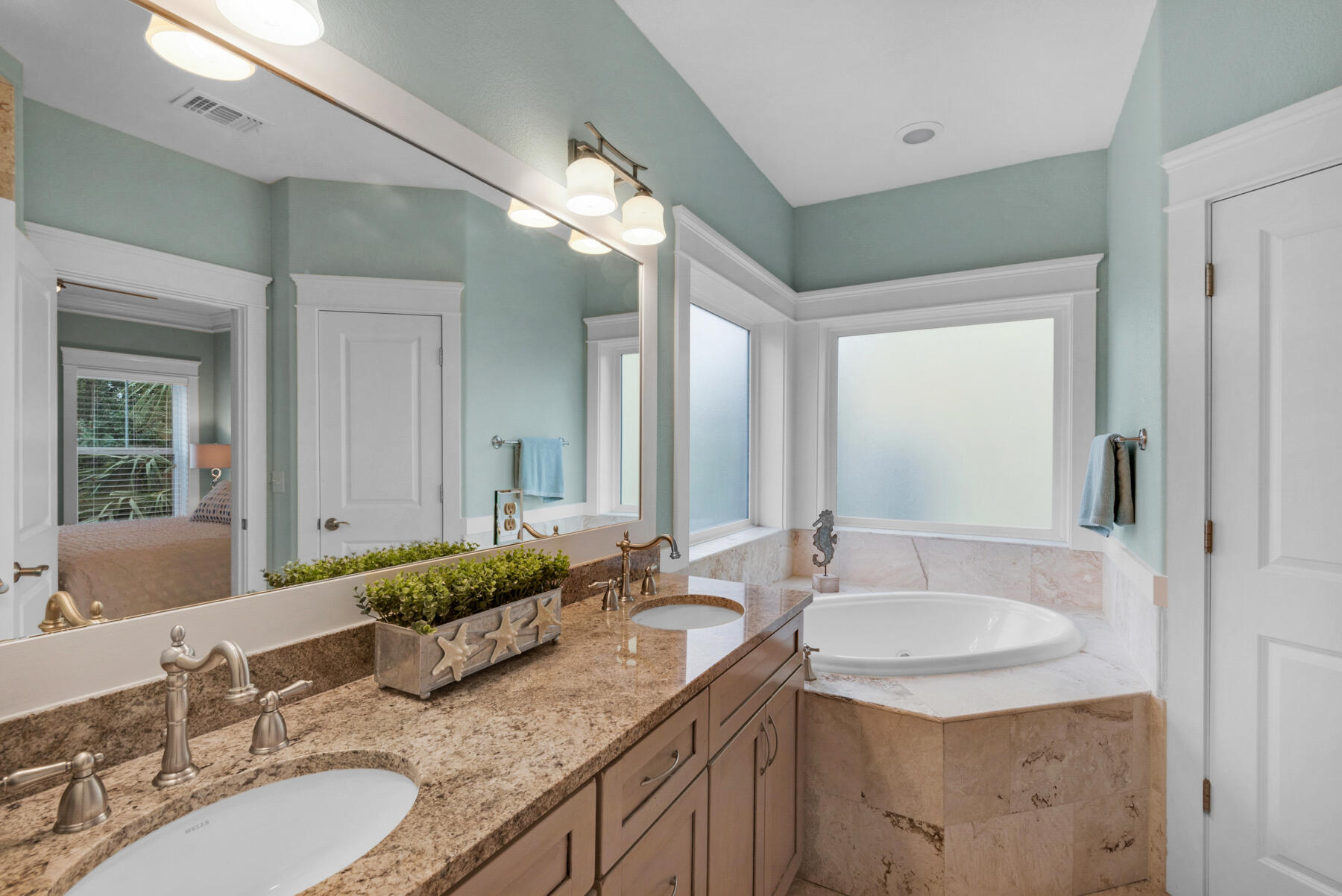 18 Merri Way Santa Rosa Beach, FL 32459 - Photo 16 of 49 a bathroom with double vanity sinks granite vanity and a mirror