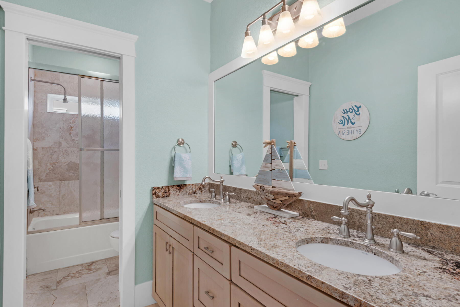 18 Merri Way Santa Rosa Beach, FL 32459 - Photo 20 of 49 a bathroom with a granite countertop sink a large mirror and a shower