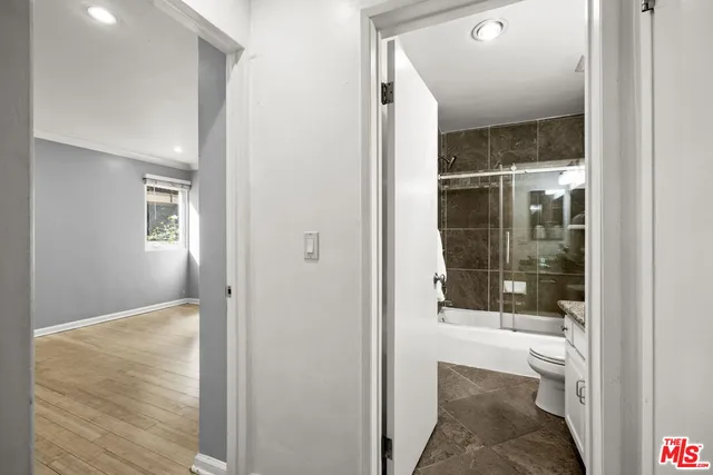 a view of a bathroom from a hallway