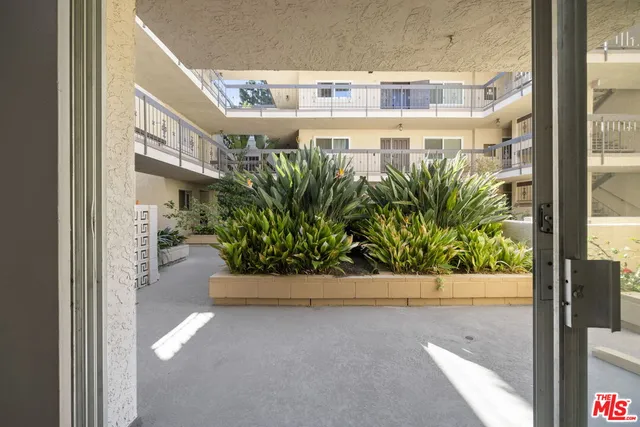a view of balcony with potted plants