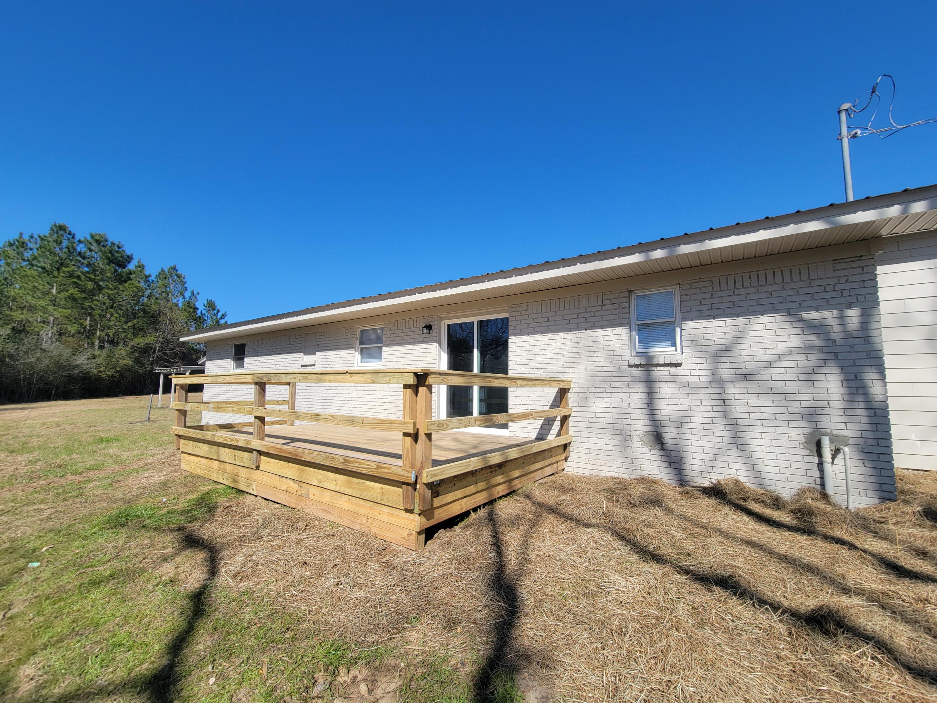 13325 Highway 331 DeFuniak Springs, FL 32433 - Photo 6 of 38 New deck off the kitchen
