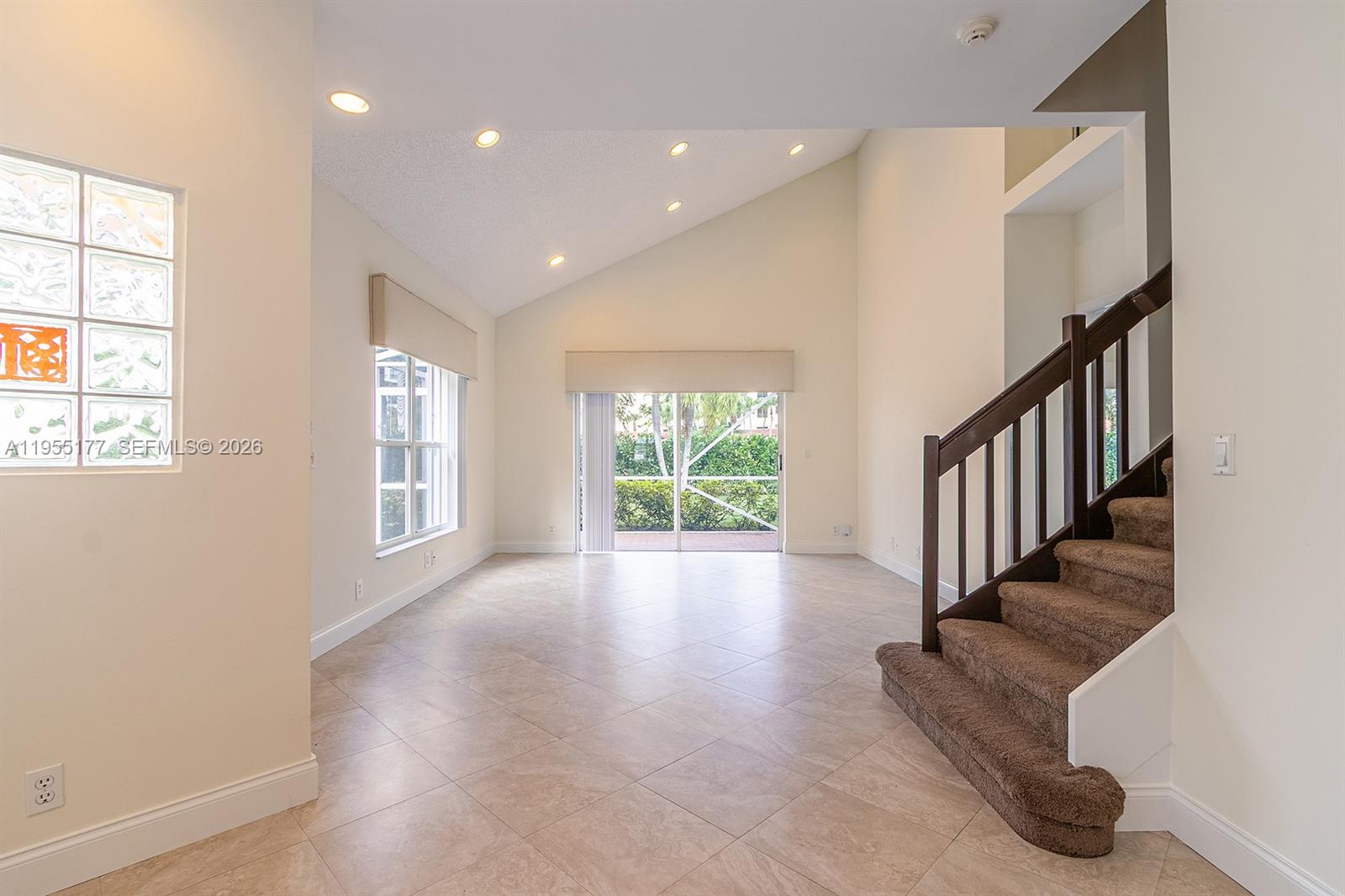 7387 Panache Way Boca Raton, FL 33433 - Photo 12 of 53 a view of an entryway with wooden floor and windows