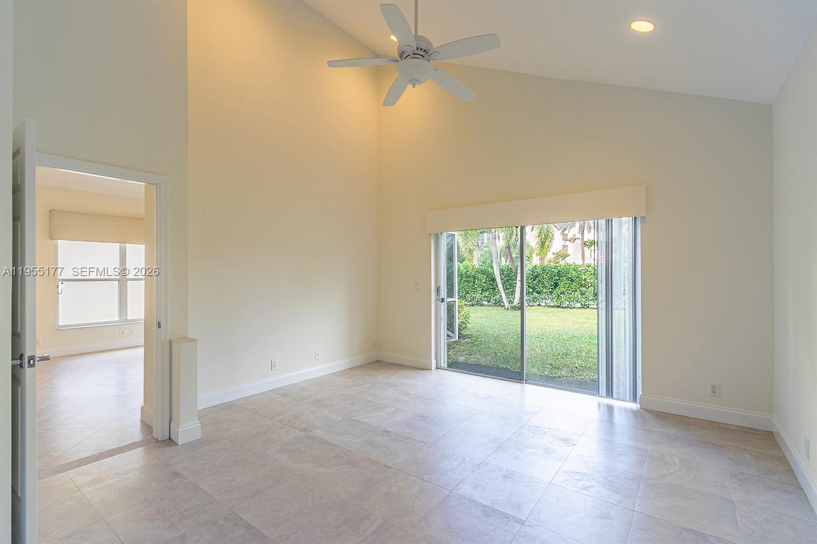 7387 Panache Way Boca Raton, FL 33433 - Photo 14 of 53 an empty room with an outdoor view and a window
