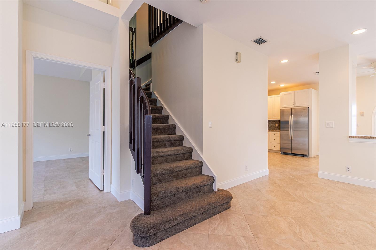 7387 Panache Way Boca Raton, FL 33433 - Photo 23 of 53 a view of a hallway with wooden floor and entryway