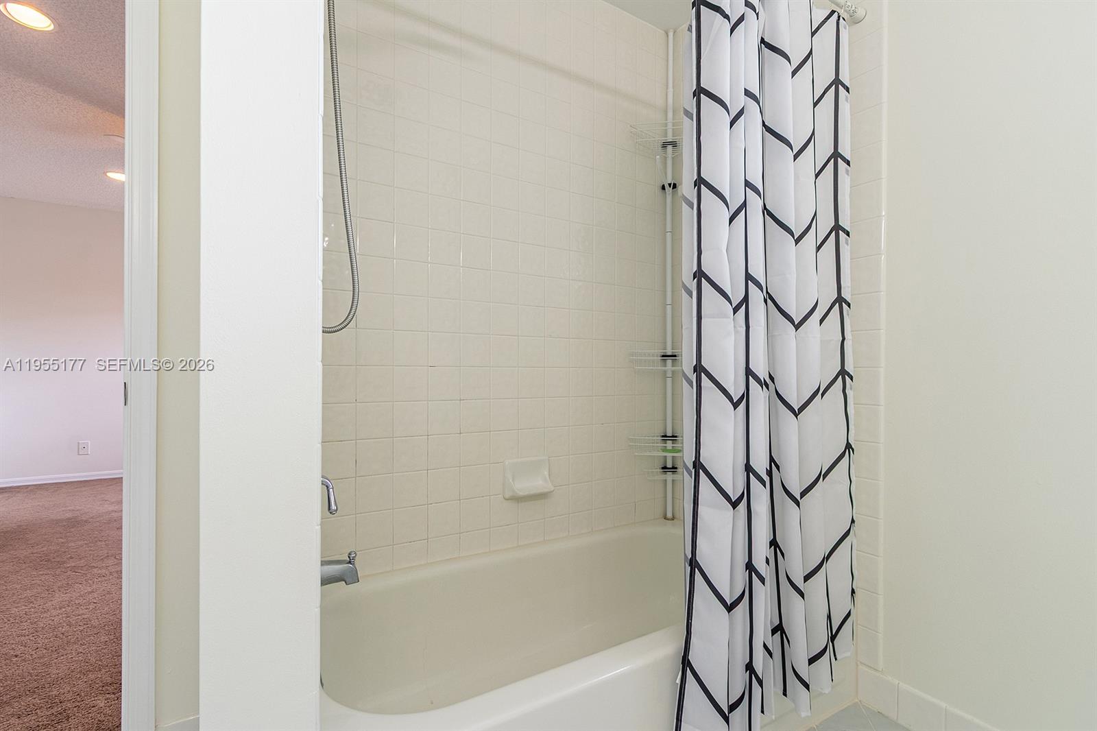 7387 Panache Way Boca Raton, FL 33433 - Photo 30 of 53 a bathroom with a bathtub and shower