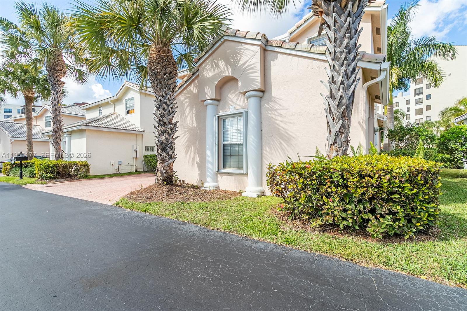 7387 Panache Way Boca Raton, FL 33433 - Photo 3 of 53 a front view of a house with a garden and trees