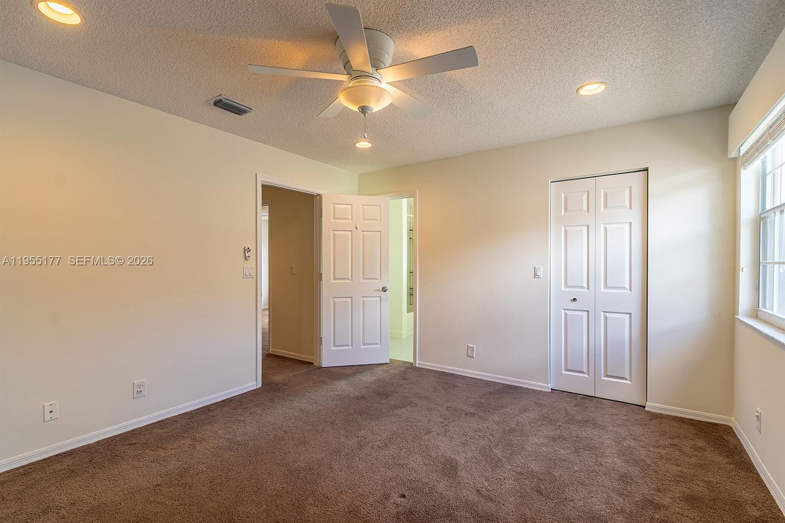 7387 Panache Way Boca Raton, FL 33433 - Photo 33 of 53 an empty room with closet and a ceiling fan
