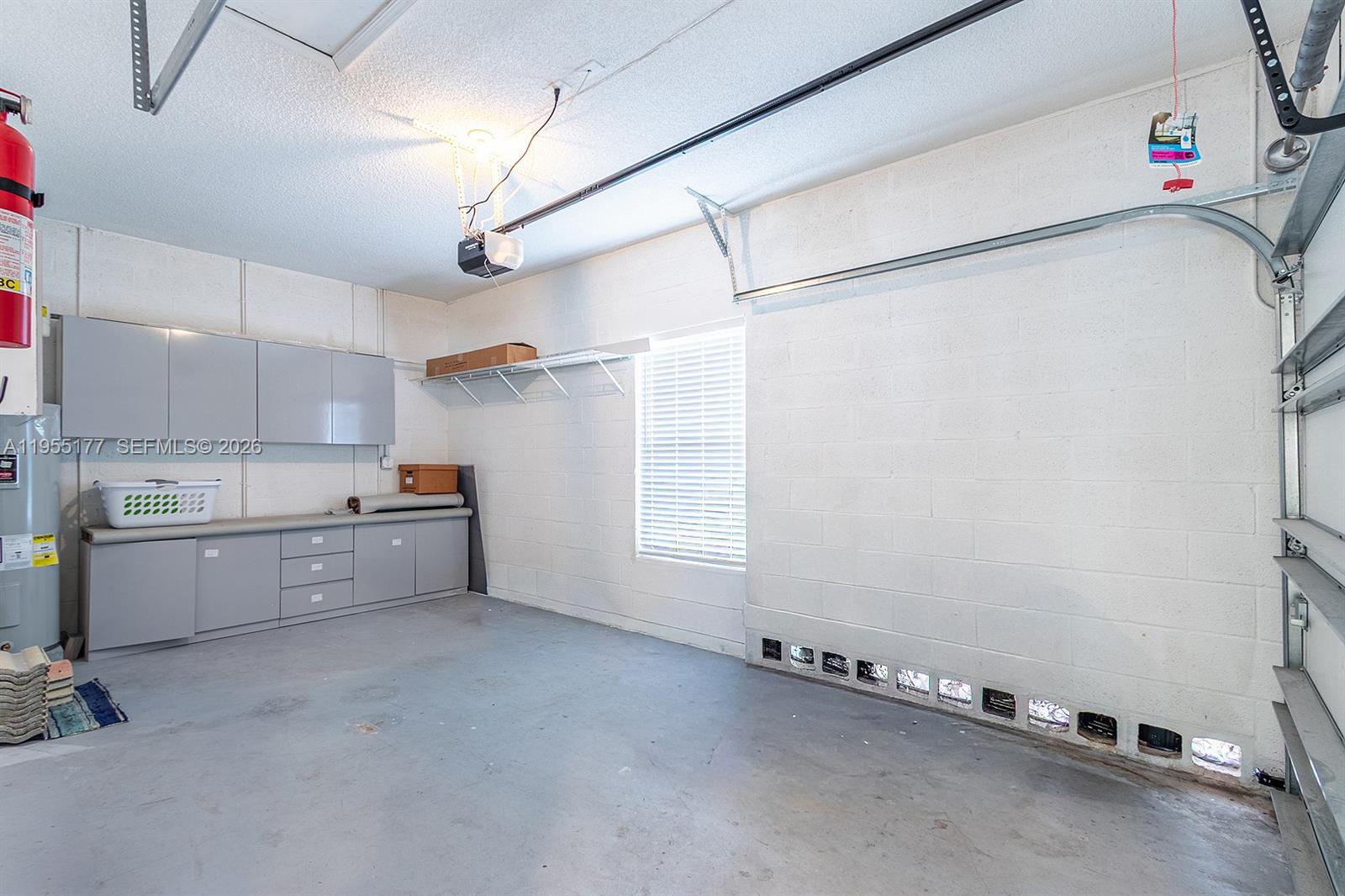 7387 Panache Way Boca Raton, FL 33433 - Photo 35 of 53 a kitchen with granite countertop a white cabinets and window