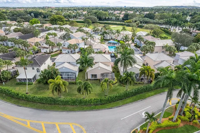 an aerial view of residential building and lake