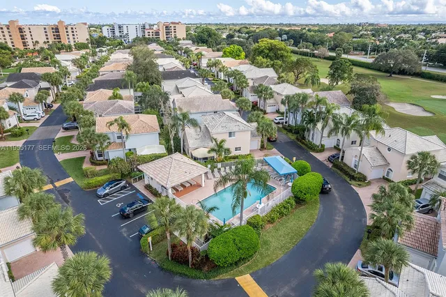a sign board with palm trees