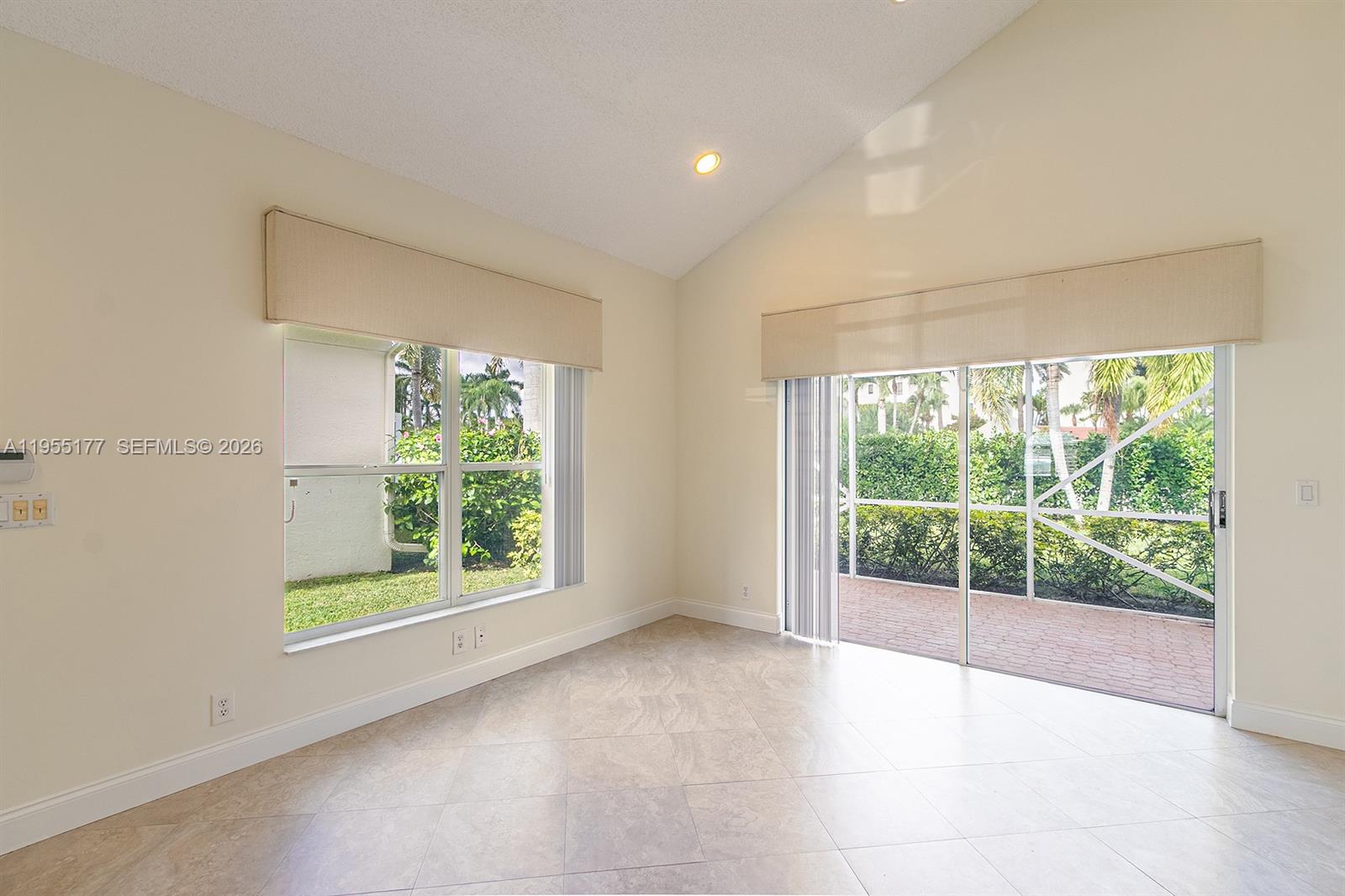 7387 Panache Way Boca Raton, FL 33433 - Photo 5 of 53 a view of an empty room with wooden floor and a window