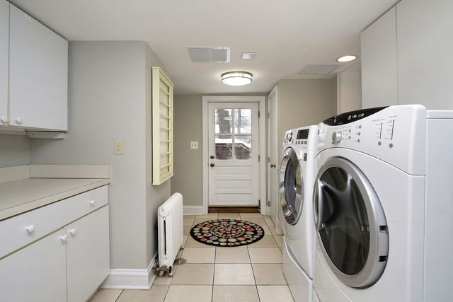 a view of a hallway with washer and dryer