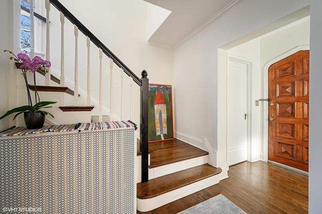 a view of an entryway with wooden floor