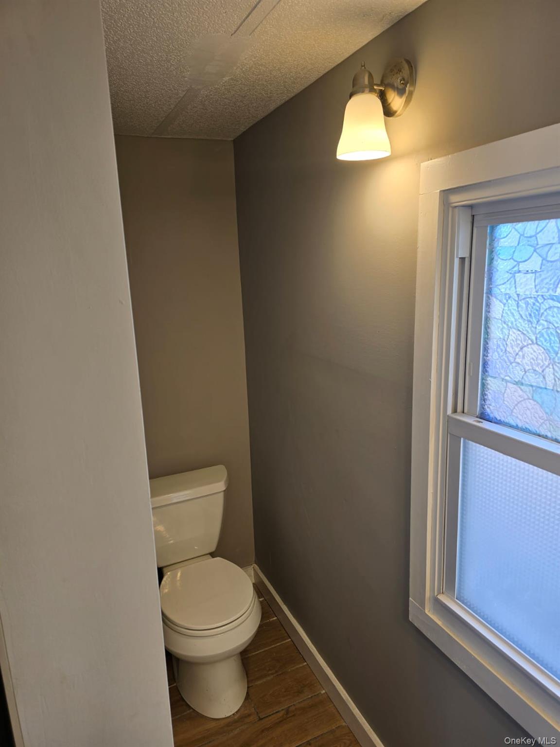 31 Cold Spring Road Monticello, NY 12701 - Photo 10 of 11 a white toilet sitting next to a window