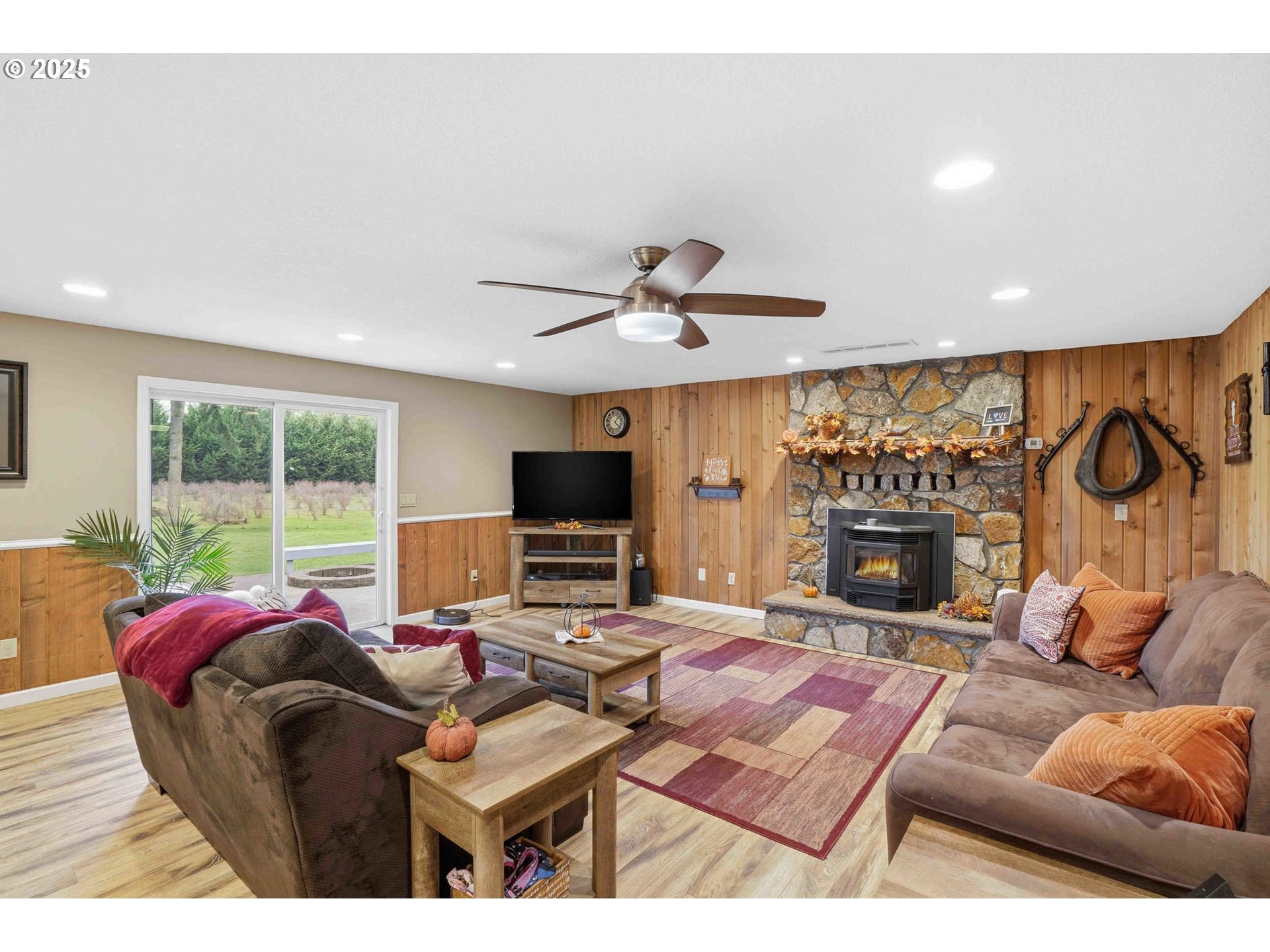 25511 Northeast 13th Street Camas, WA 98607 - Photo 13 of 36 a living room with furniture a fireplace and a flat screen tv