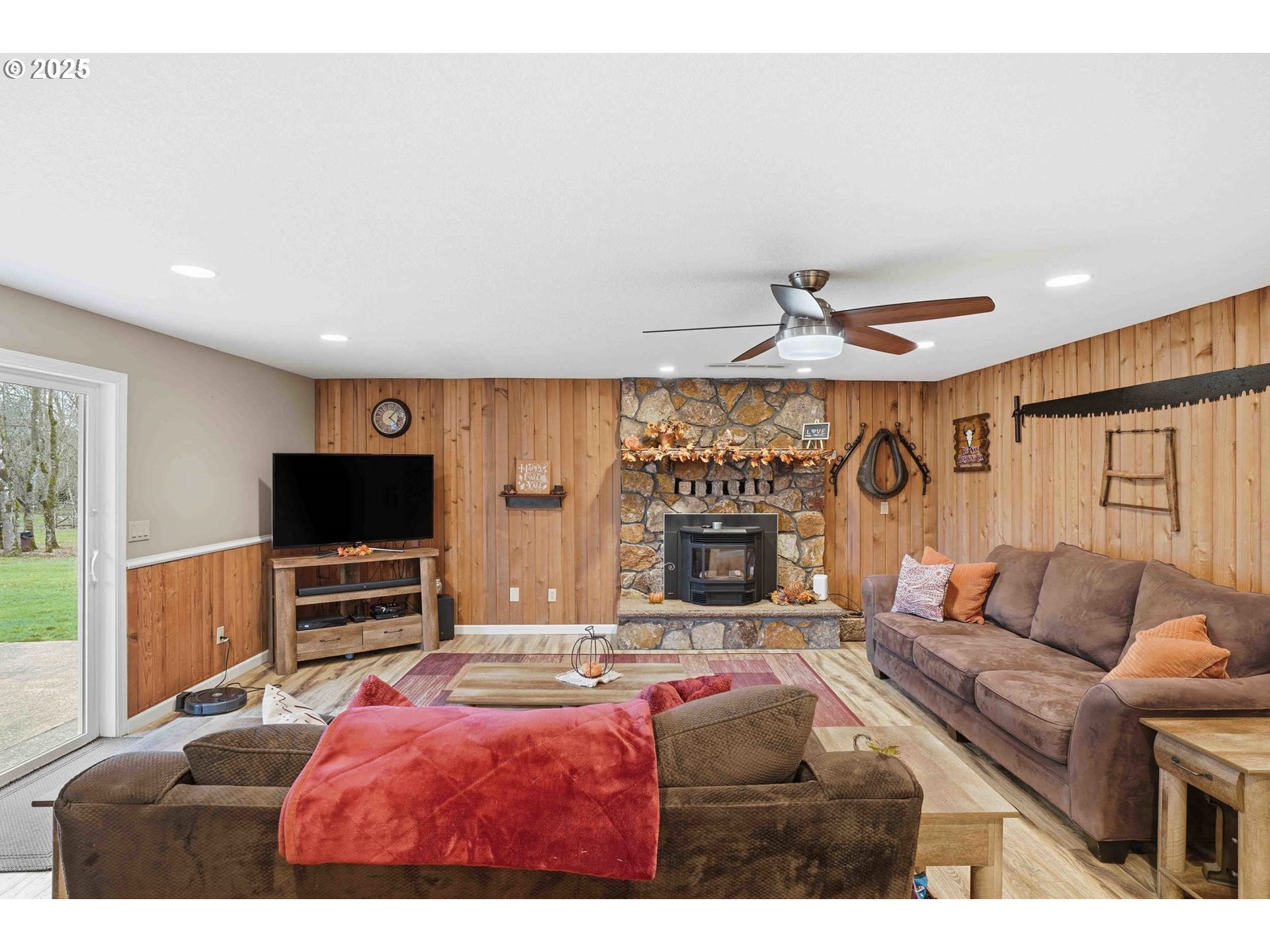 25511 Northeast 13th Street Camas, WA 98607 - Photo 14 of 36 a living room with furniture a flat screen tv and a fireplace