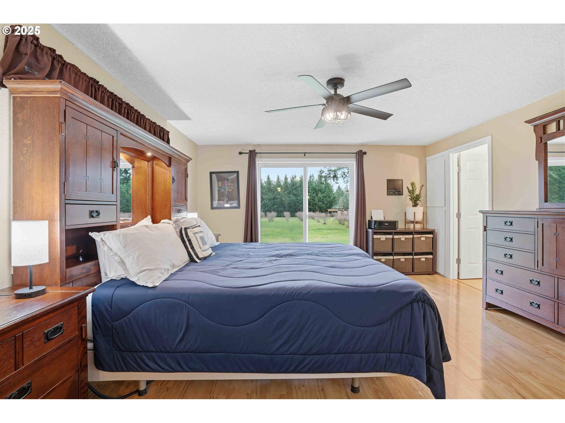 25511 Northeast 13th Street Camas, WA 98607 - Photo 15 of 36 a bedroom with a large bed and a tv