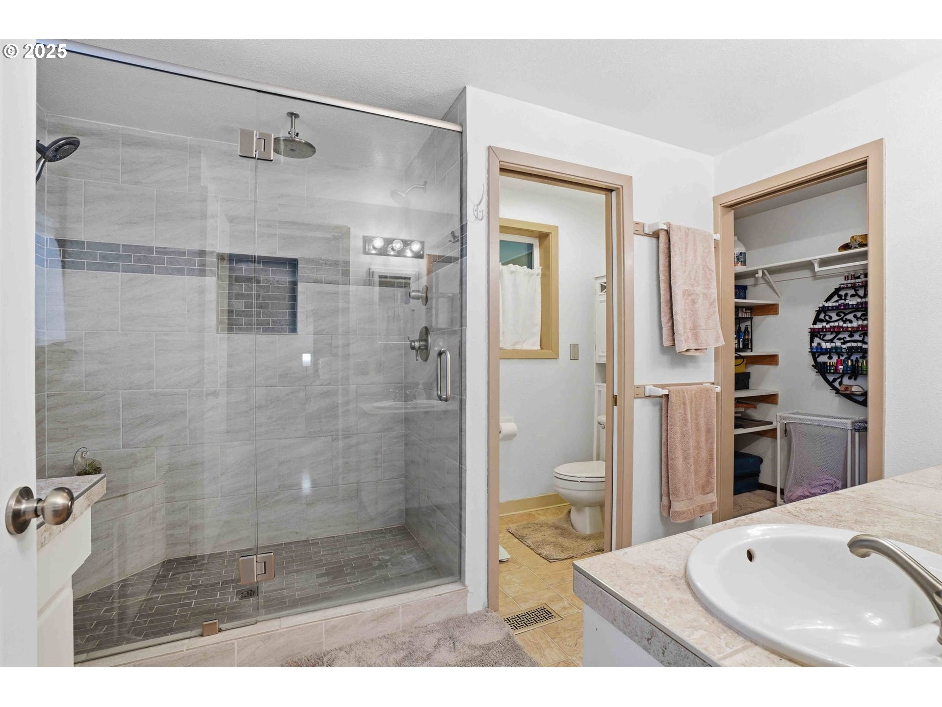 25511 Northeast 13th Street Camas, WA 98607 - Photo 18 of 36 a bathroom with a sink and a shower
