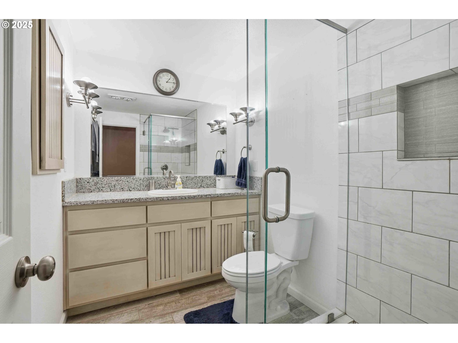 25511 Northeast 13th Street Camas, WA 98607 - Photo 22 of 36 a bathroom with a toilet a sink and mirror