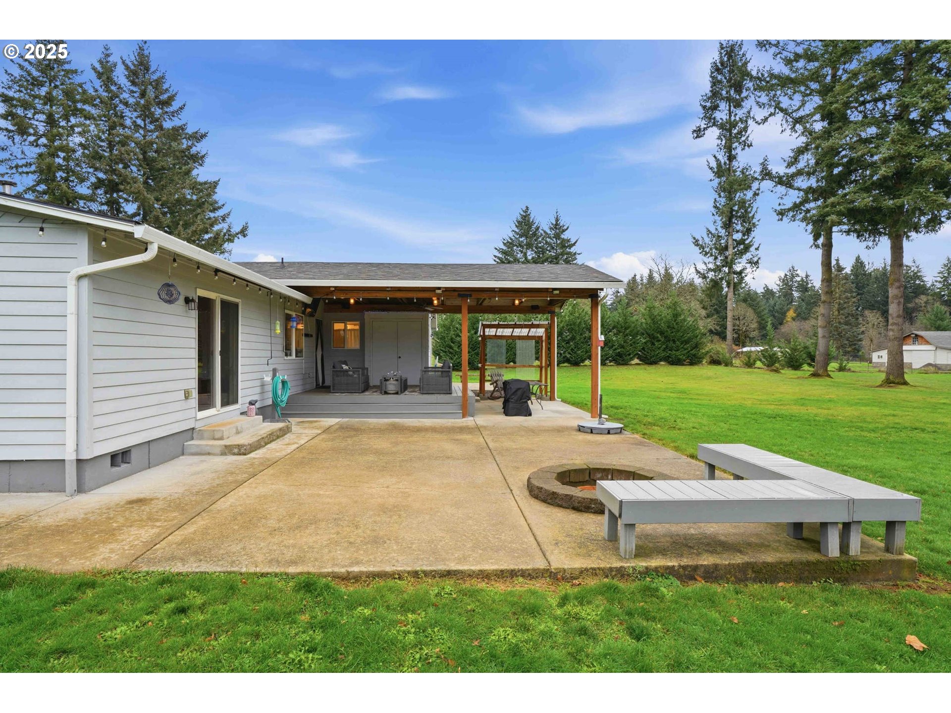 25511 Northeast 13th Street Camas, WA 98607 - Photo 29 of 36 a view of a house with backyard porch and sitting area