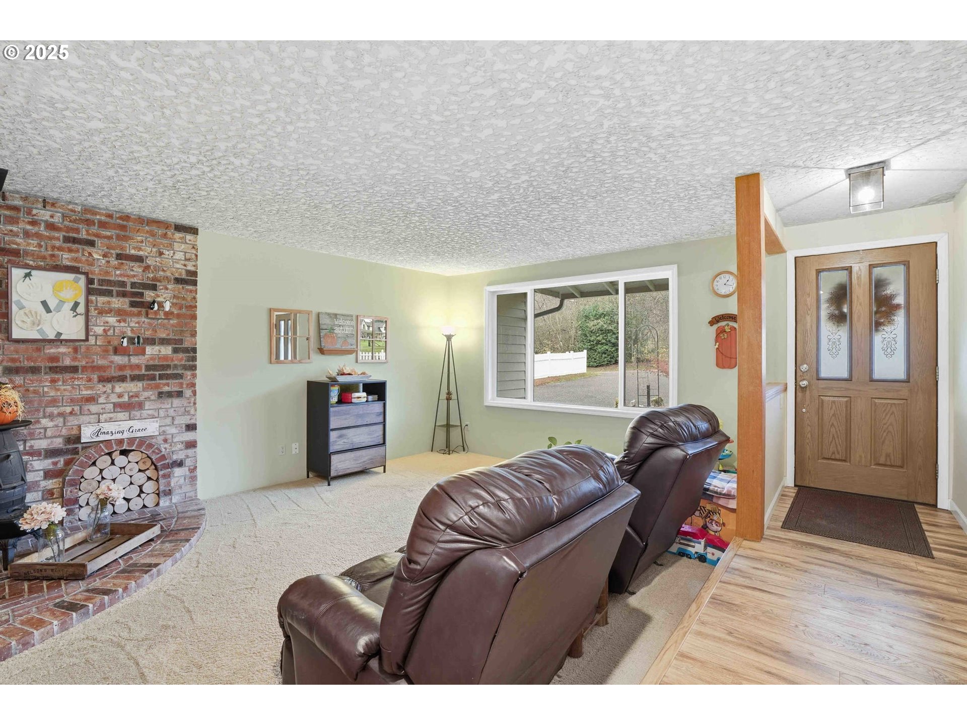 25511 Northeast 13th Street Camas, WA 98607 - Photo 4 of 36 a living room with furniture a flat screen tv and a window