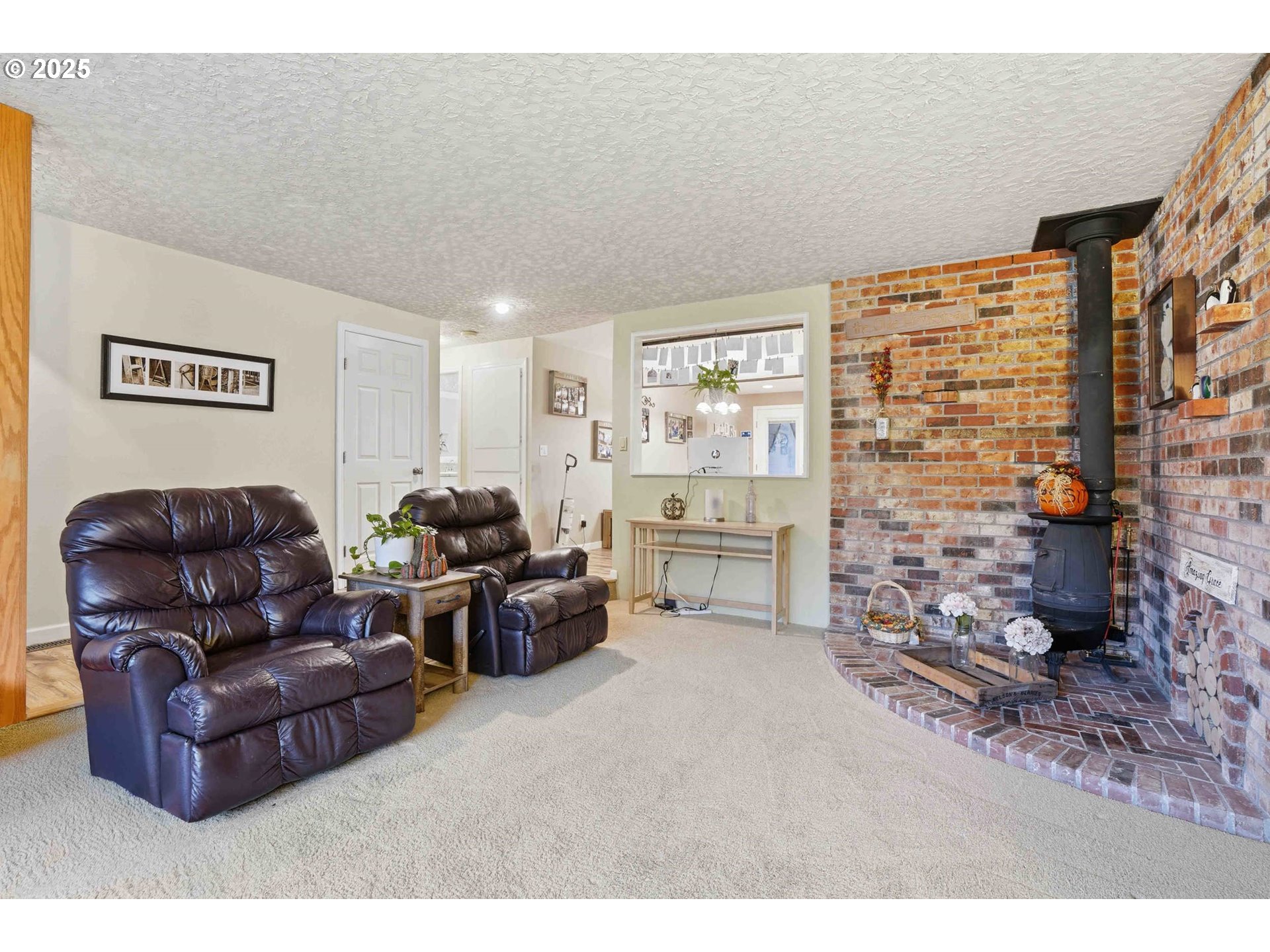 25511 Northeast 13th Street Camas, WA 98607 - Photo 5 of 36 a living room with furniture and a fireplace