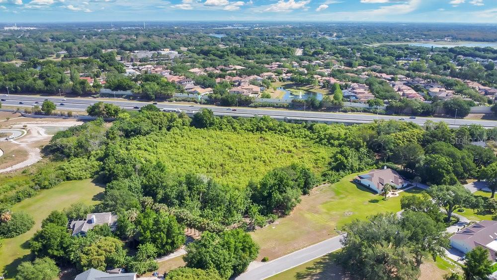 1661 Roberts Landing Road Windermere, FL 34786 - Photo 13 of 20 an aerial view of residential houses with outdoor space and trees