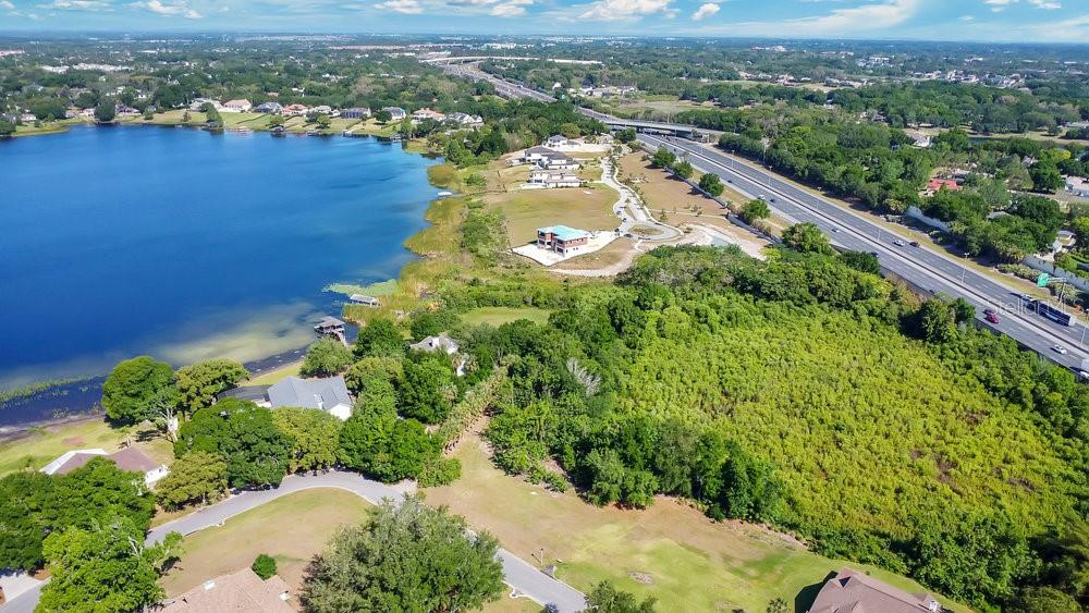 1661 Roberts Landing Road Windermere, FL 34786 - Photo 6 of 20 an aerial view of lake residential house with swimming pool and mountain view
