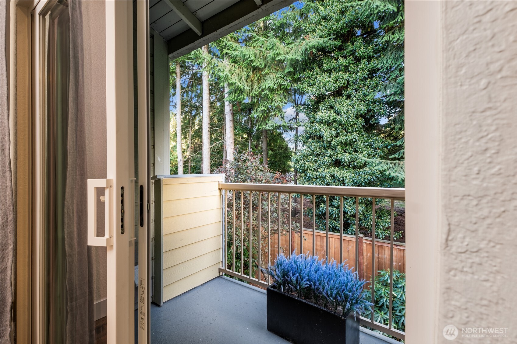 14401 Southeast Petrovitsky Road, Unit B209 Renton, WA 98058 - Photo 11 of 35 a view of a balcony with chairs