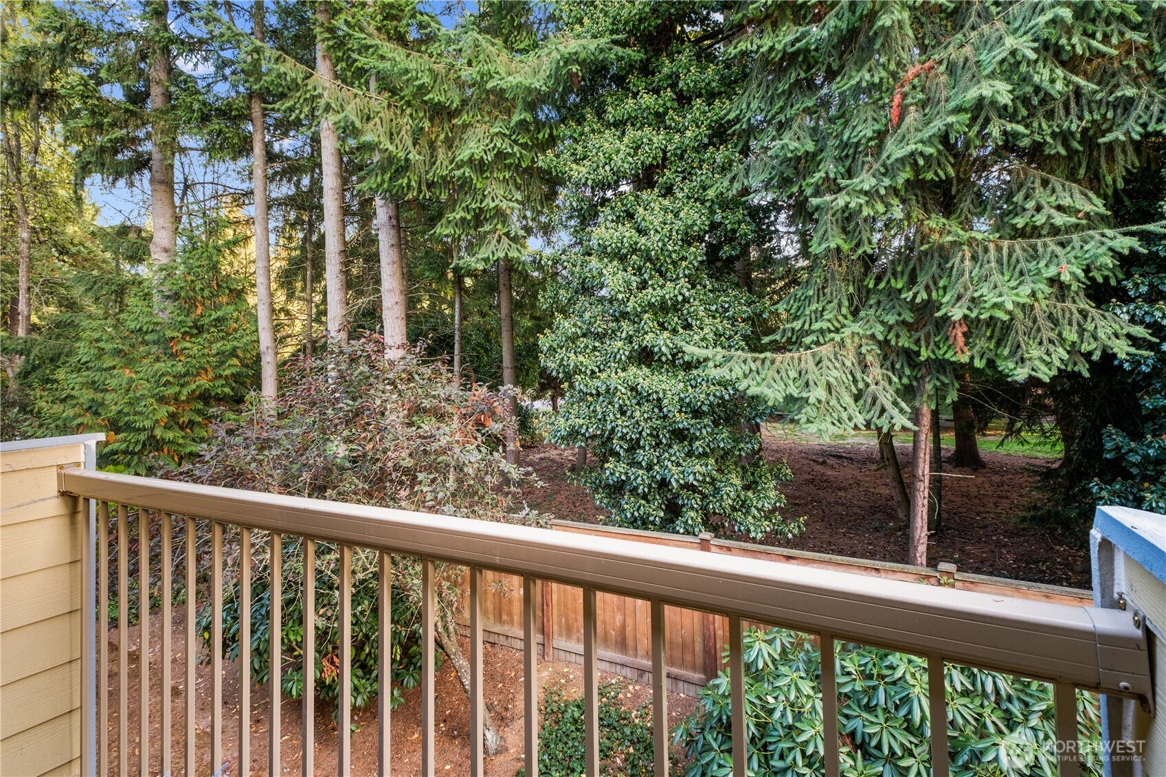 14401 Southeast Petrovitsky Road, Unit B209 Renton, WA 98058 - Photo 12 of 35 a view of a balcony with trees