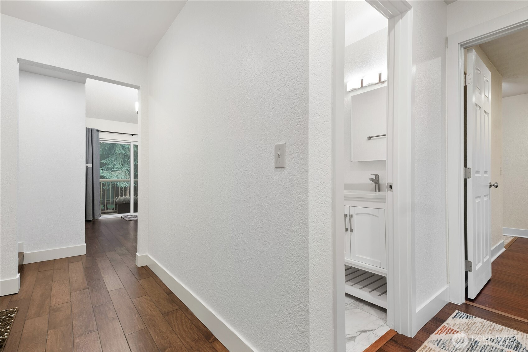 14401 Southeast Petrovitsky Road, Unit B209 Renton, WA 98058 - Photo 18 of 35 wooden floor in a gallery