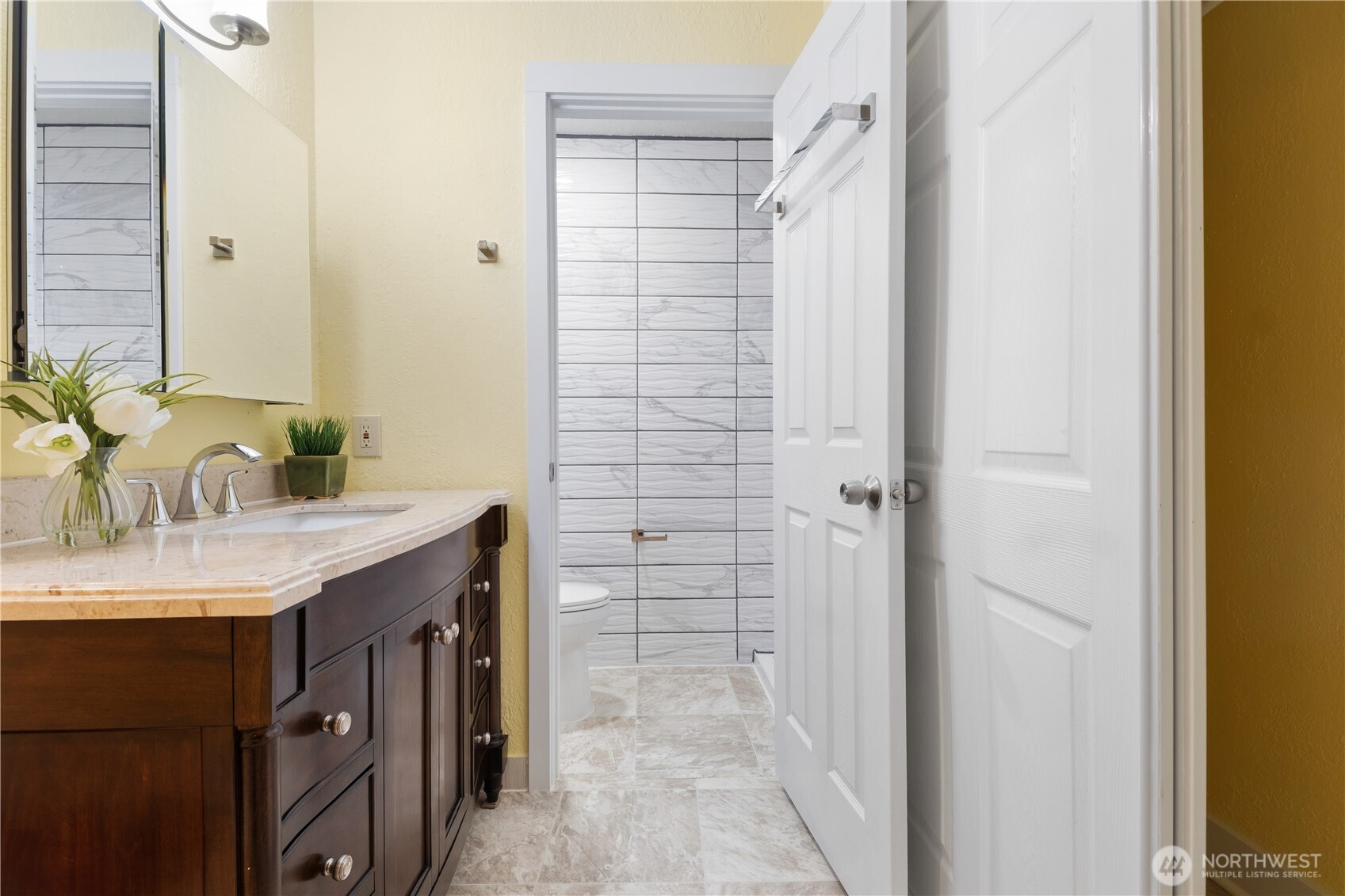 14401 Southeast Petrovitsky Road, Unit B209 Renton, WA 98058 - Photo 22 of 35 a bathroom with a granite countertop sink and a mirror