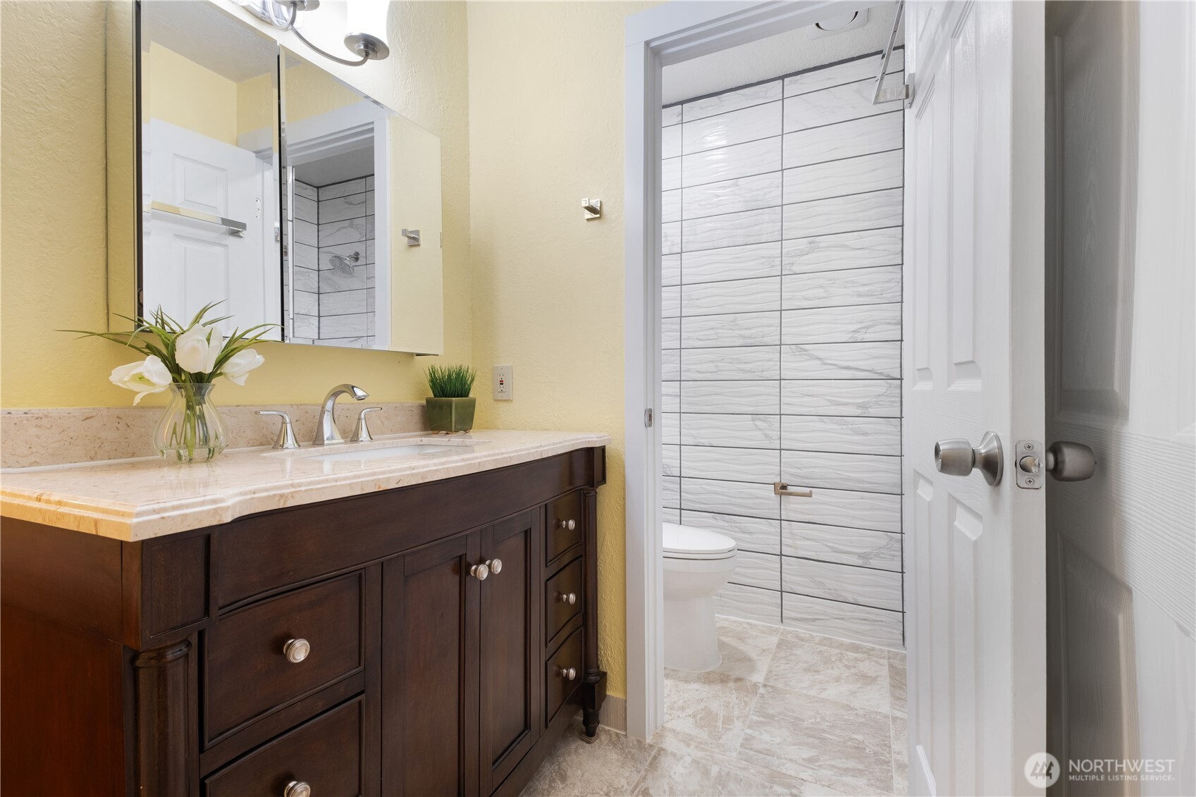 14401 Southeast Petrovitsky Road, Unit B209 Renton, WA 98058 - Photo 23 of 35 a bathroom with a sink and a mirror